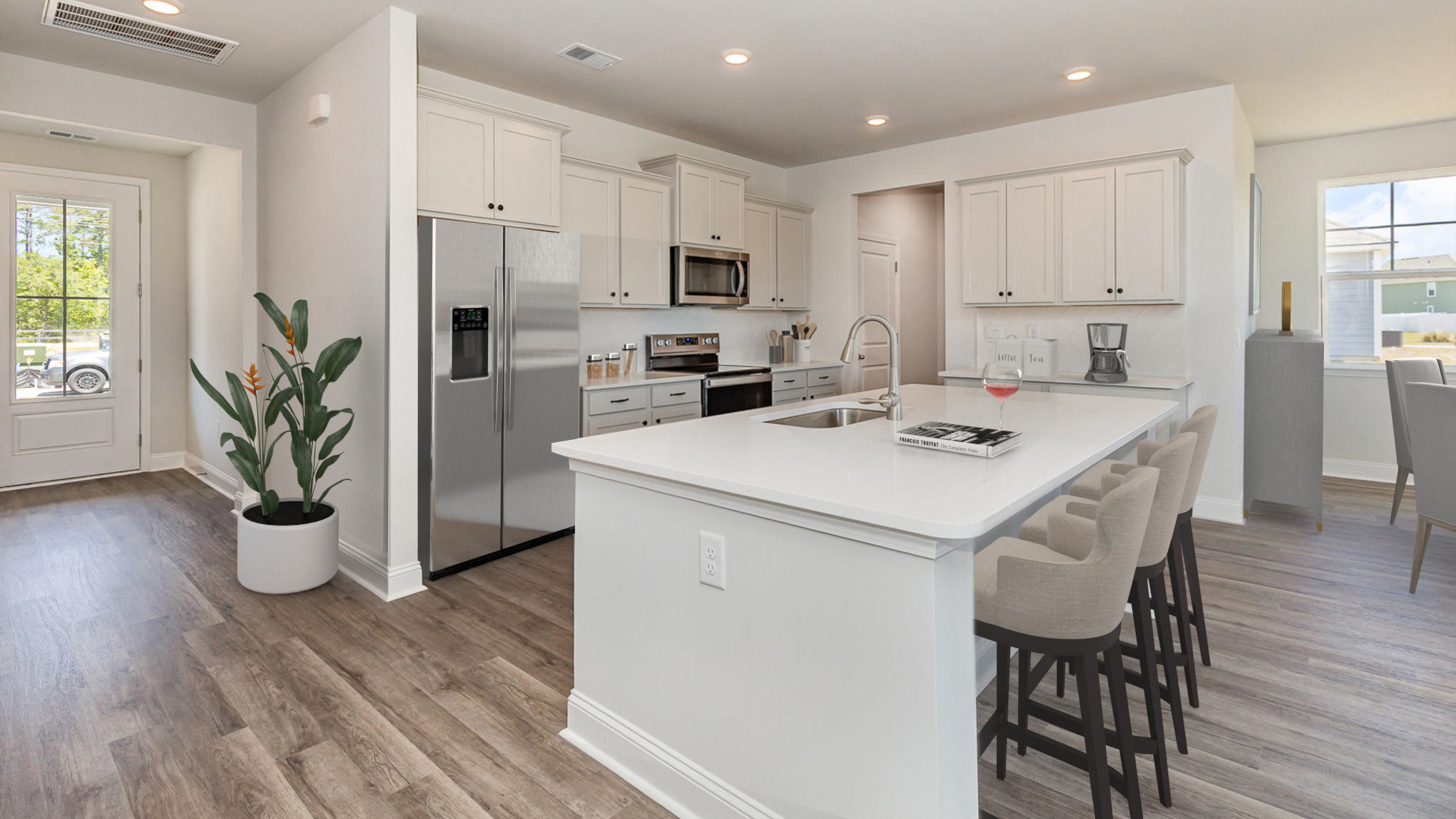Modern kitchen with white cabinets and white quartz
