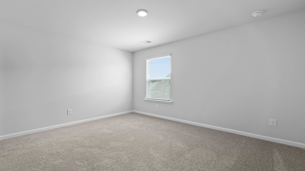 Spacious guest bedroom in a two-story home