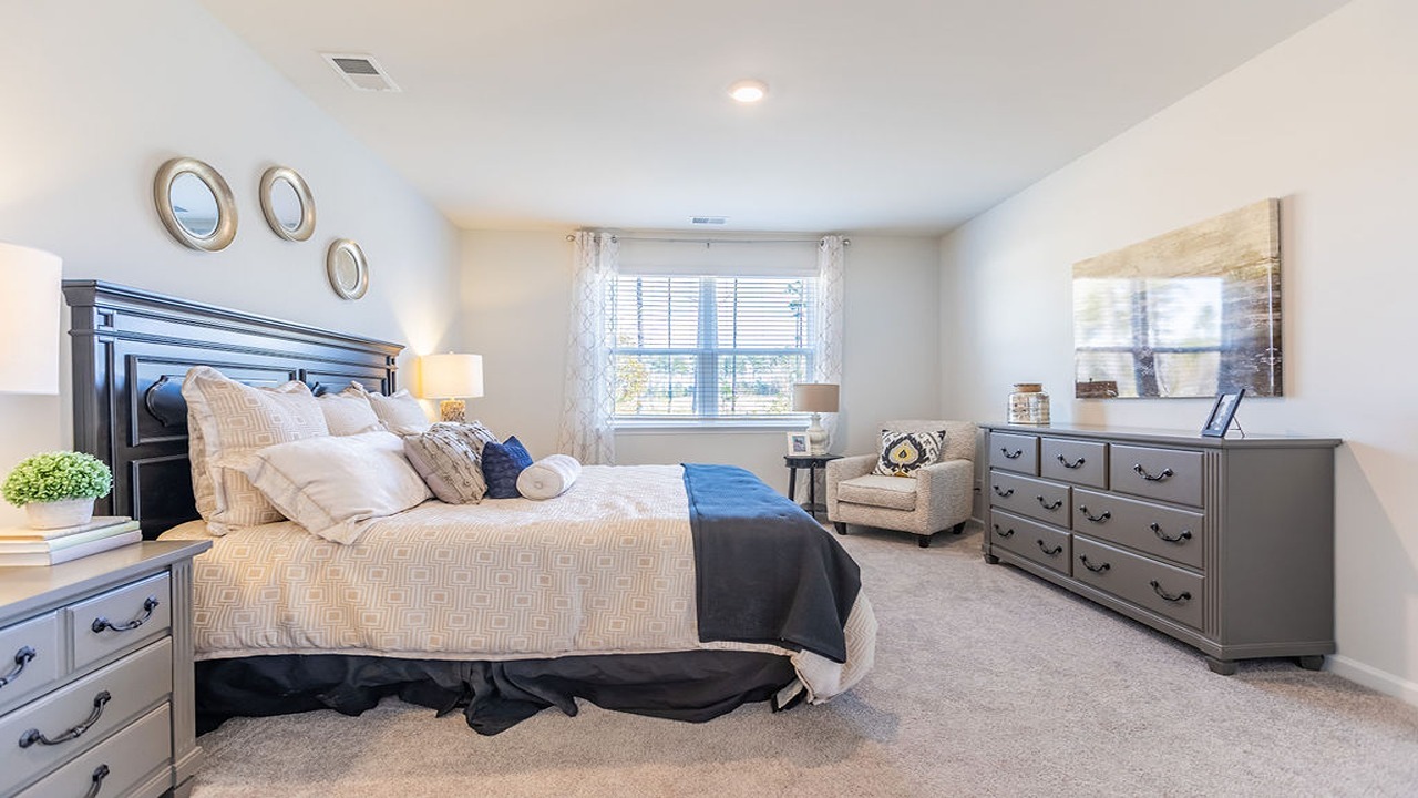 Primary bedroom with large windows
