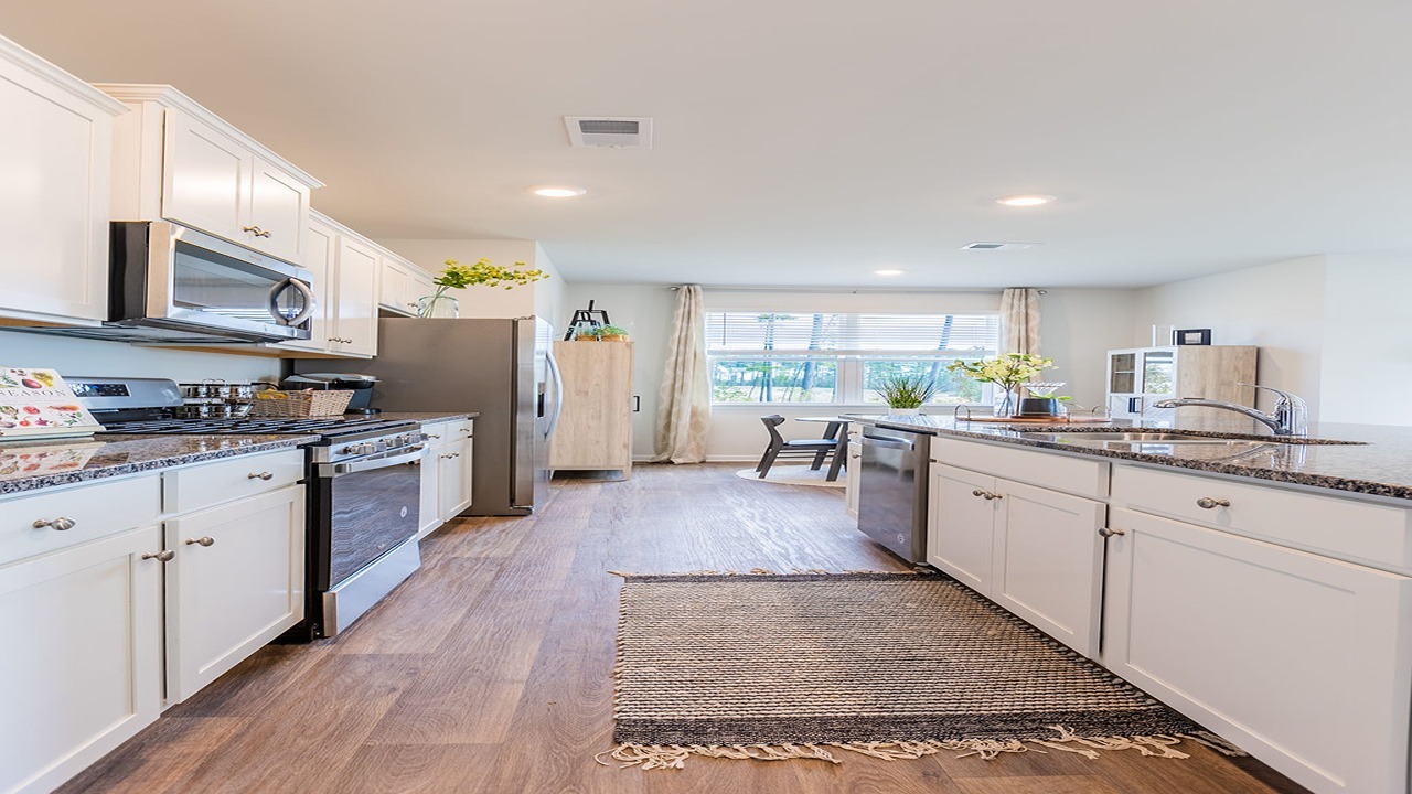 Kitchen with white countertops and granite