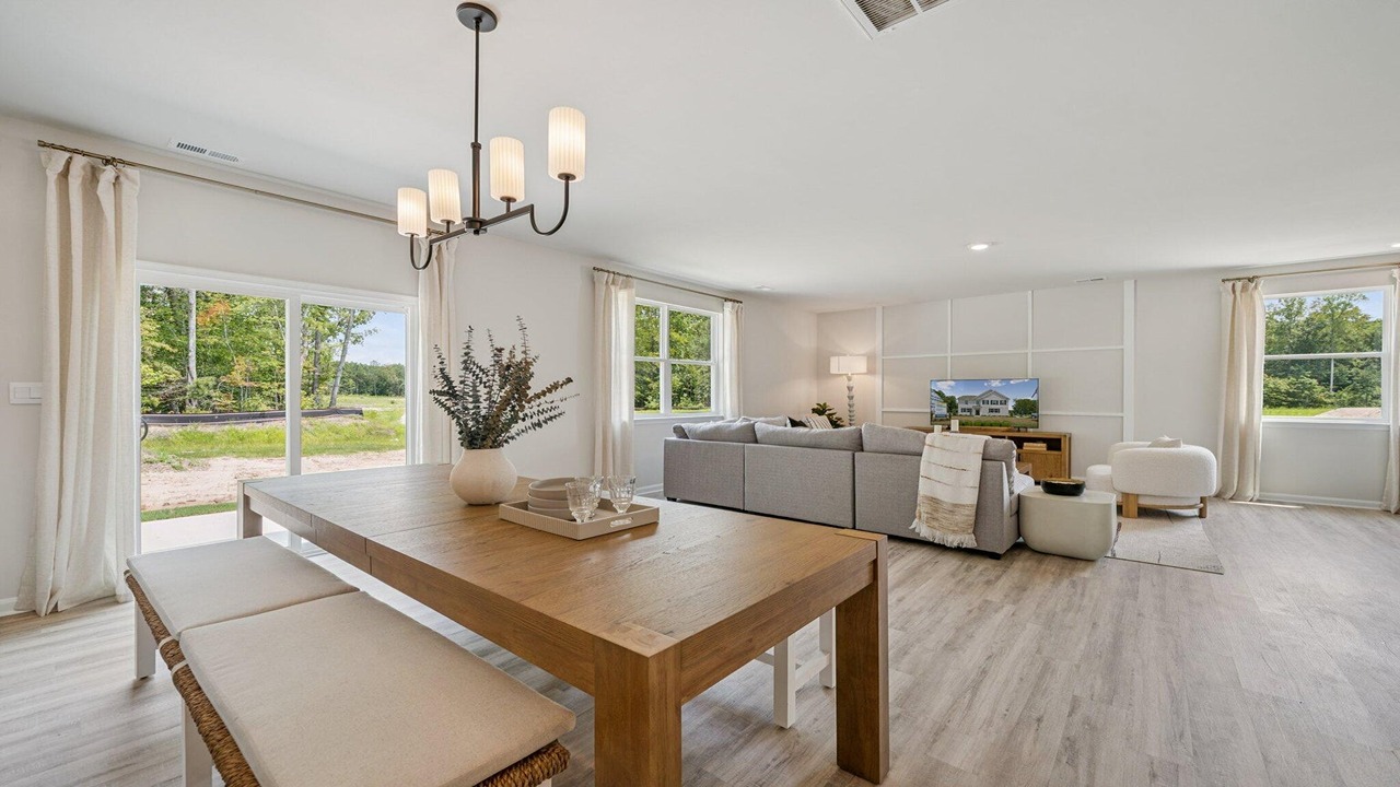 Living area connected to the kitchen in a bright open-concept design.