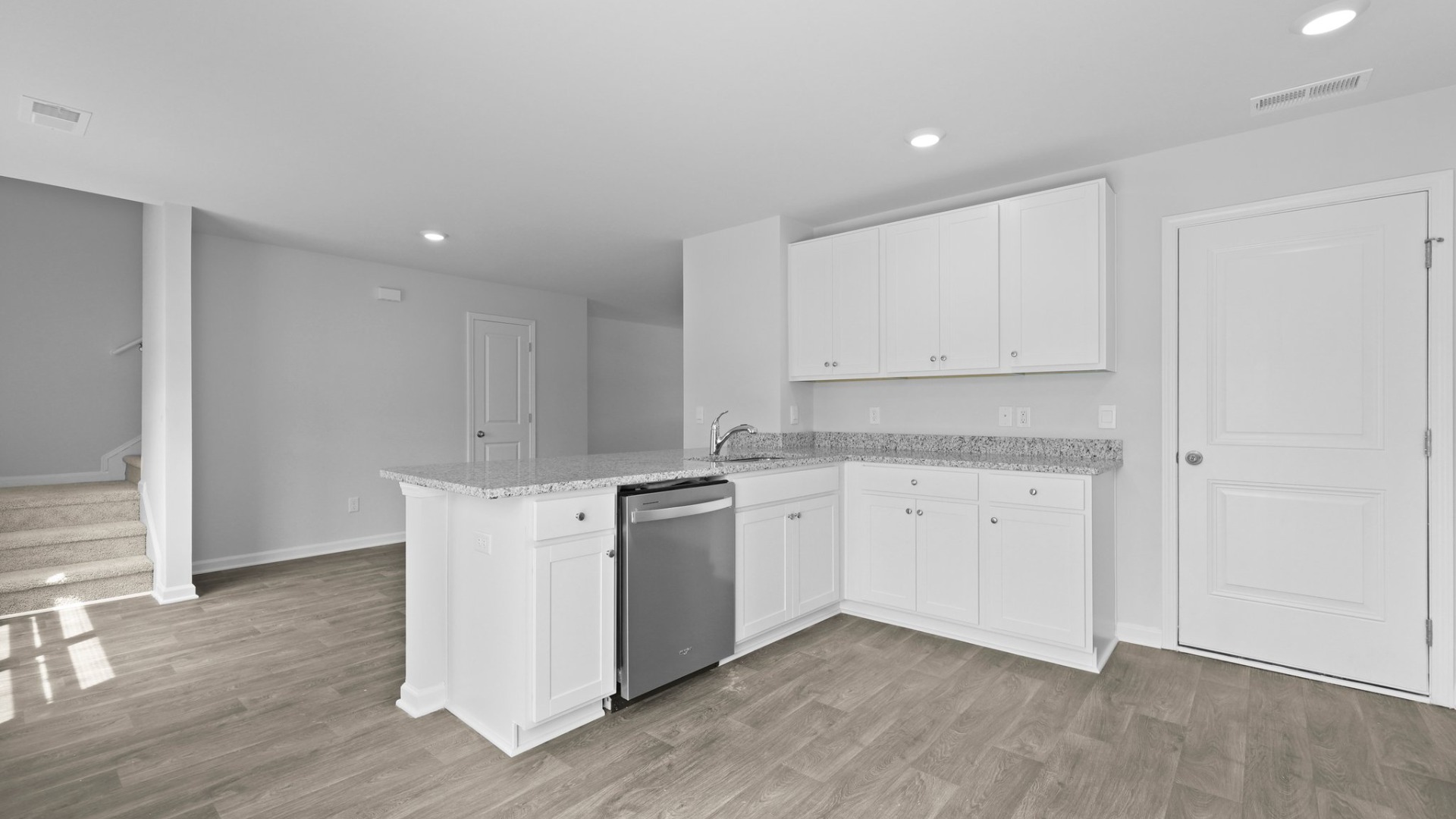 The kitchen in the Brandon is spacious with a seperate area for the stove and oven.