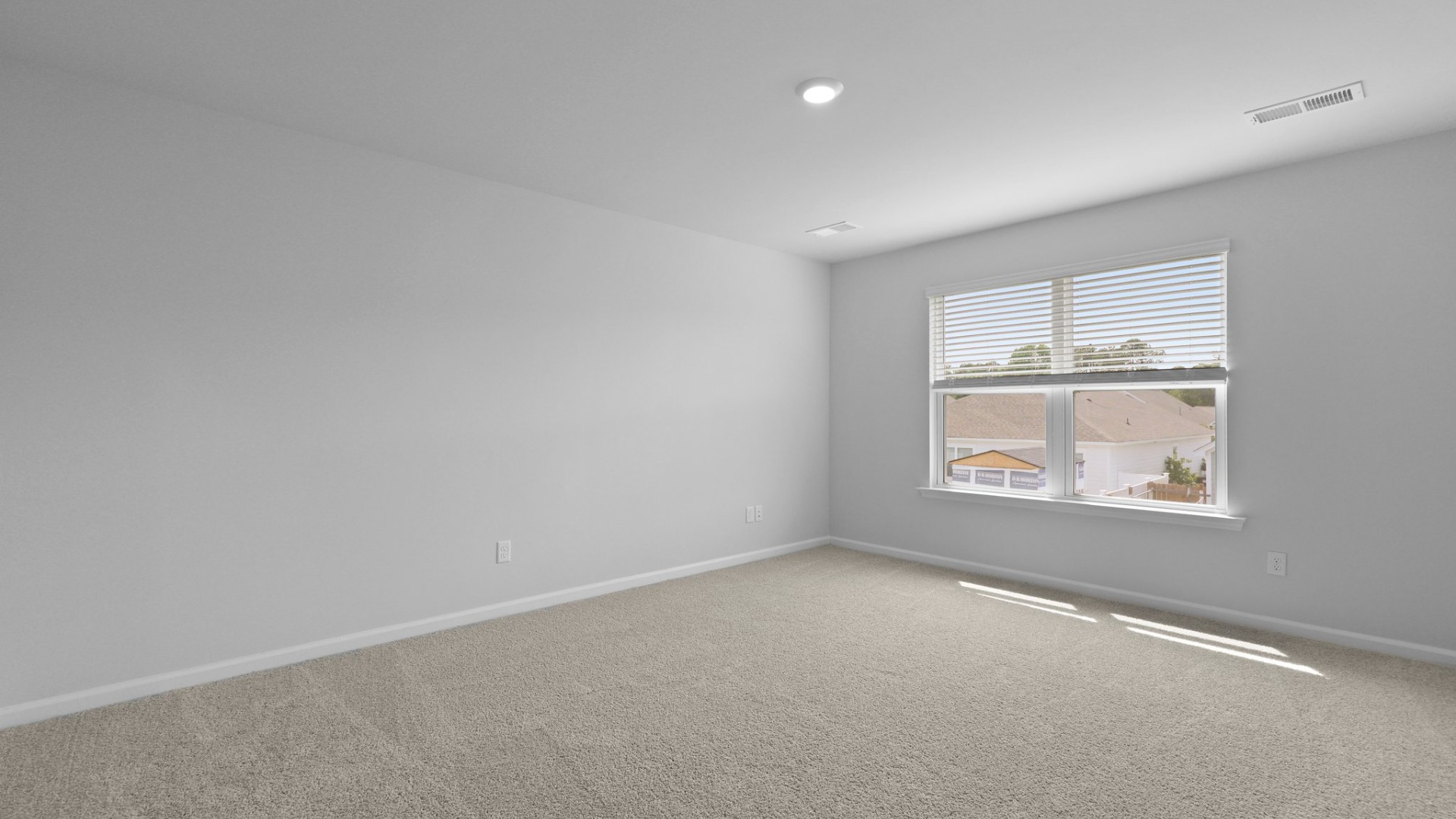 The primary bedroom is located upstairs and is carpeted.