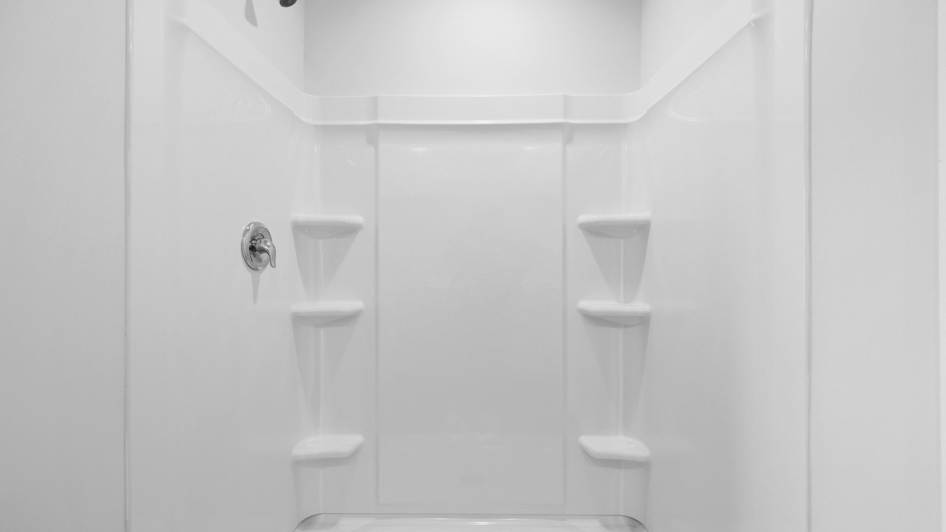 The tub and shower combination in the primary bathroom.