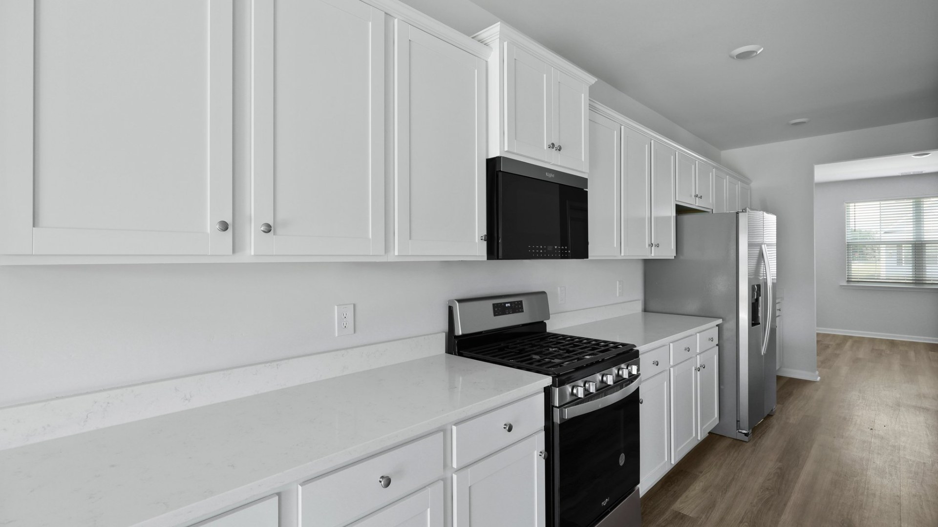 Kitchen with white cabinetry