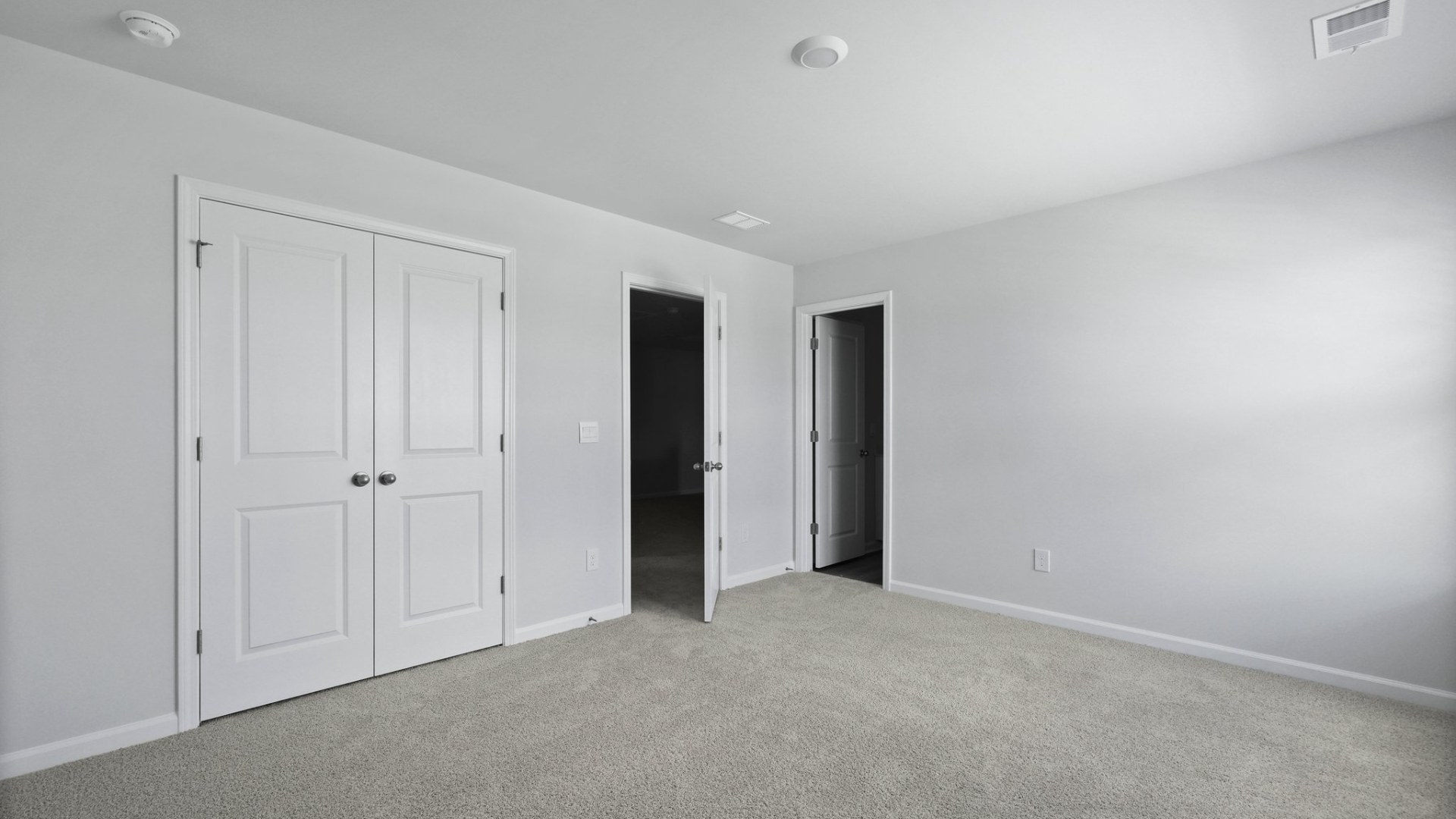 Spacious guest bedroom with large closet