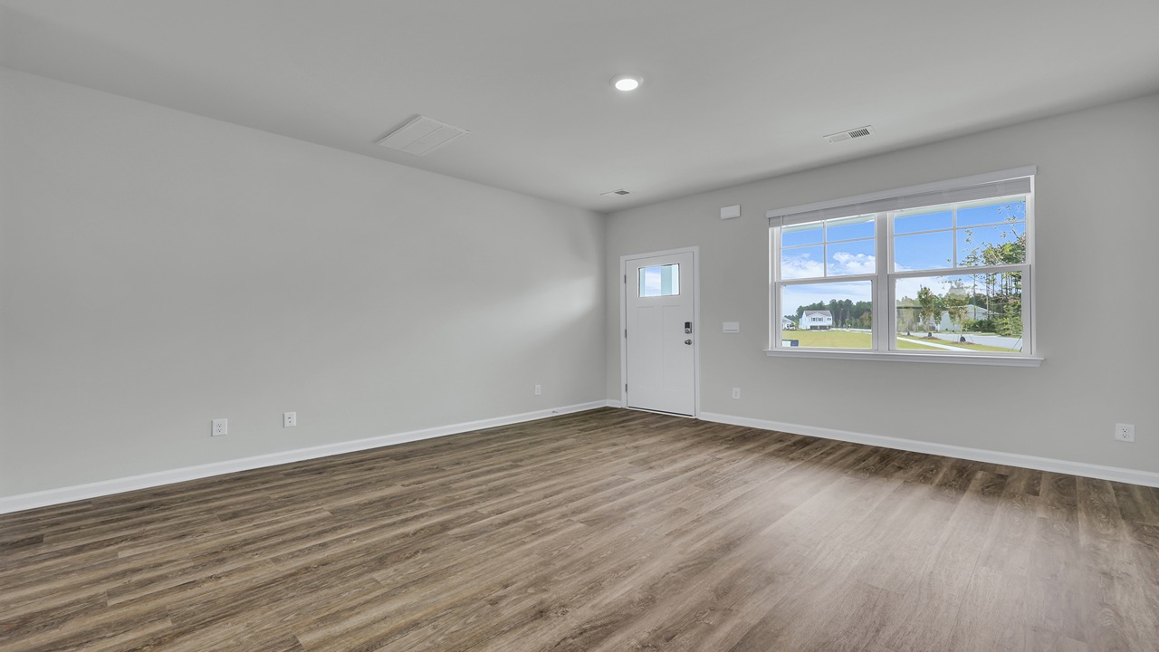 Spacious living room and entry way in the front of the home.