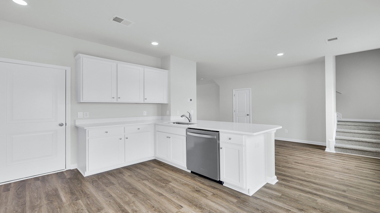 Ample cabinet space and counterspace in the kitchen.