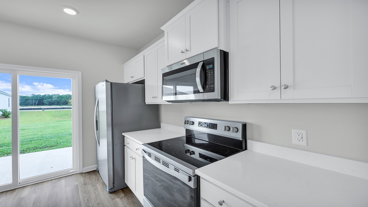 Stainless steel appliances located in the kitchen.