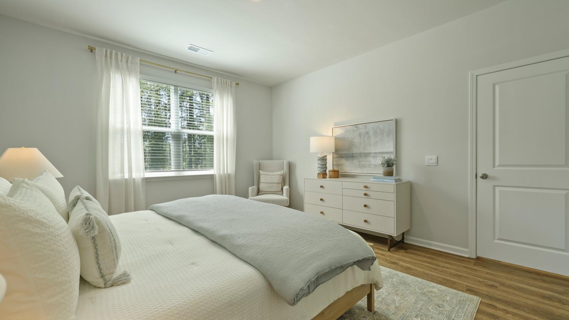 Primary bedroom with high ceilings