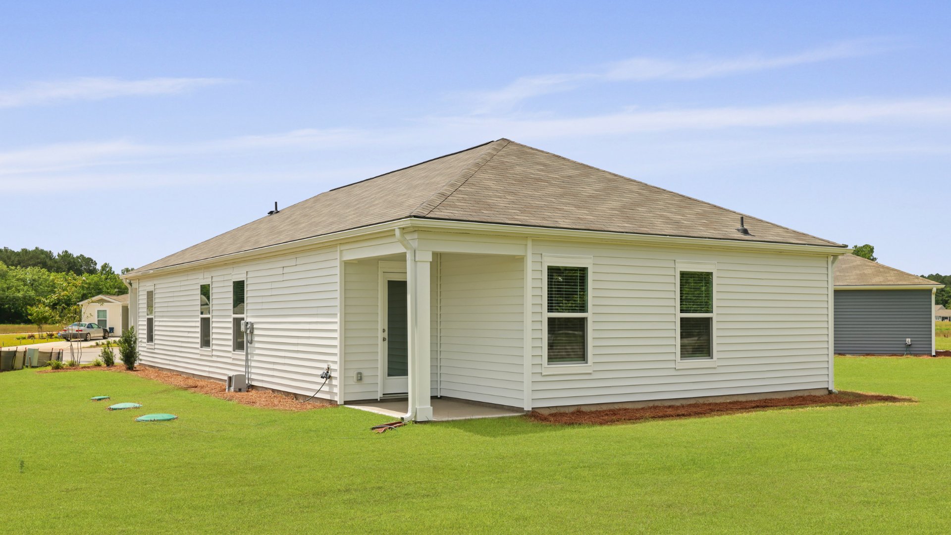 The rear exterior of the Downing floorplan, in Evergreen, located in Holly Hill, South Carolina.