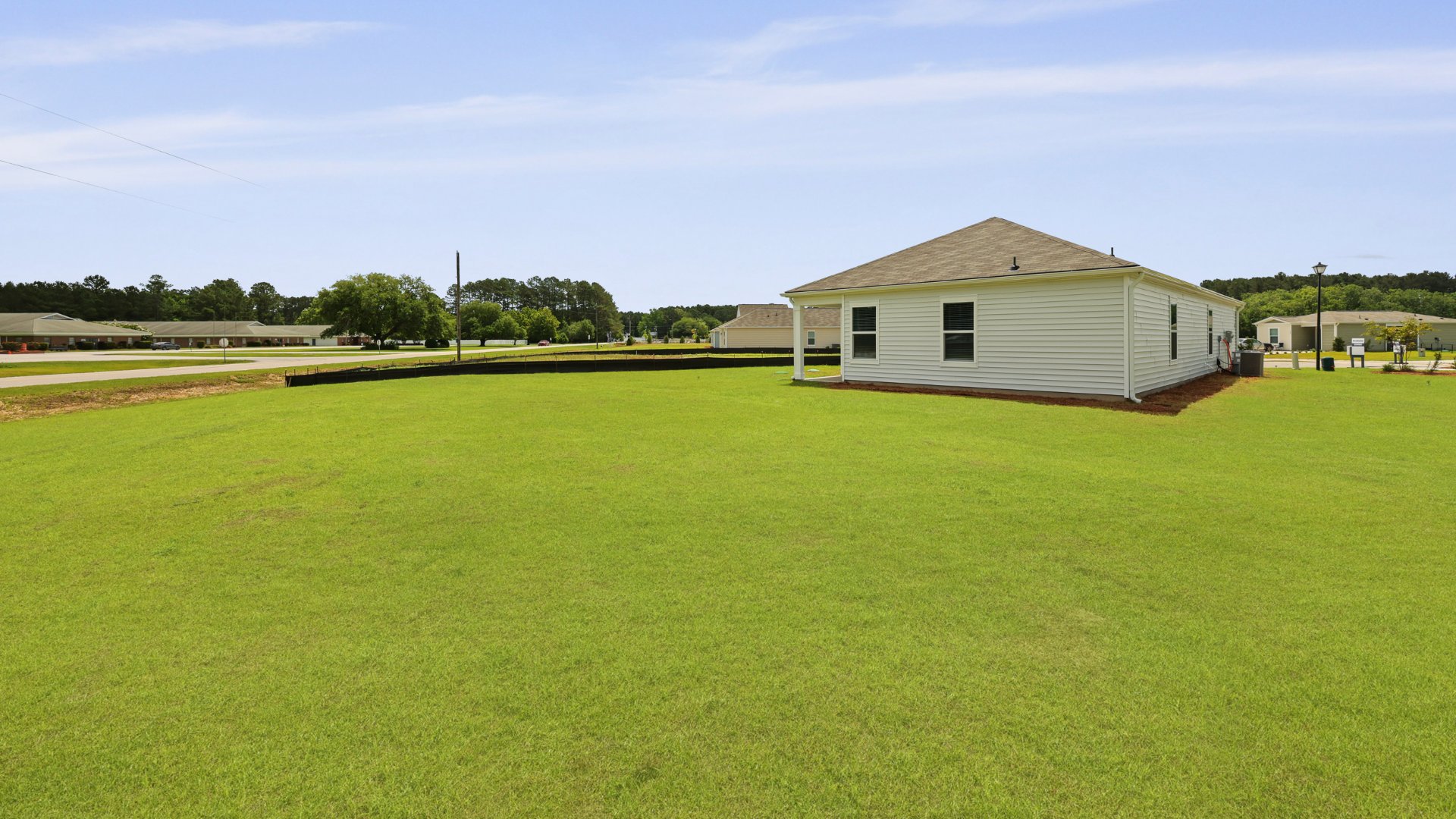 The rear exterior of the Downing floorplan, in Evergreen, located in Holly Hill, South Carolina.