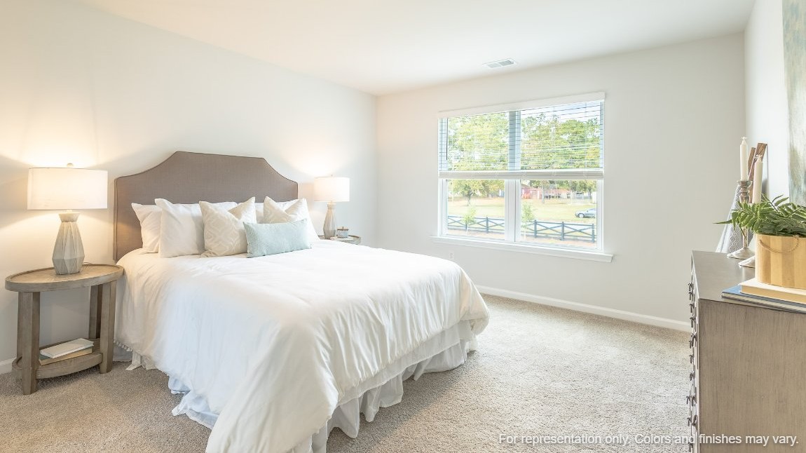 The primary bedroom is located upstairs and is spacious.