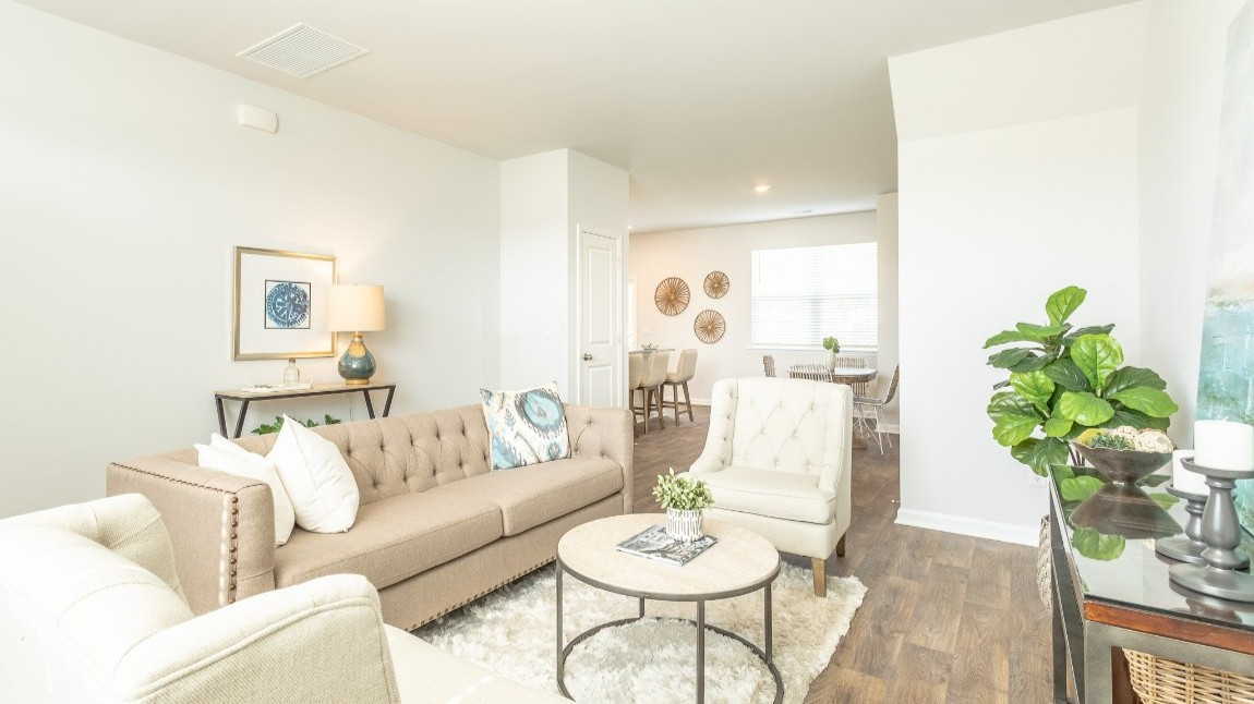 The spacious living room is a great space for entertaining and hosting guest.