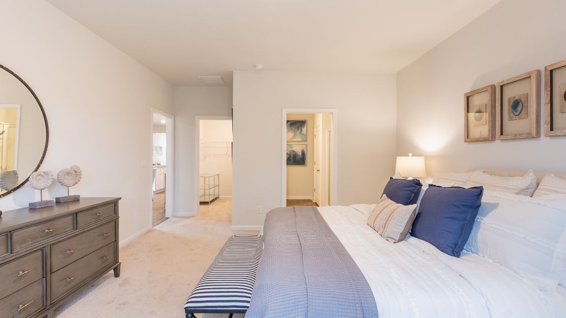 There is an ensuite bathroom and walk-in closet in the primary bedroom.