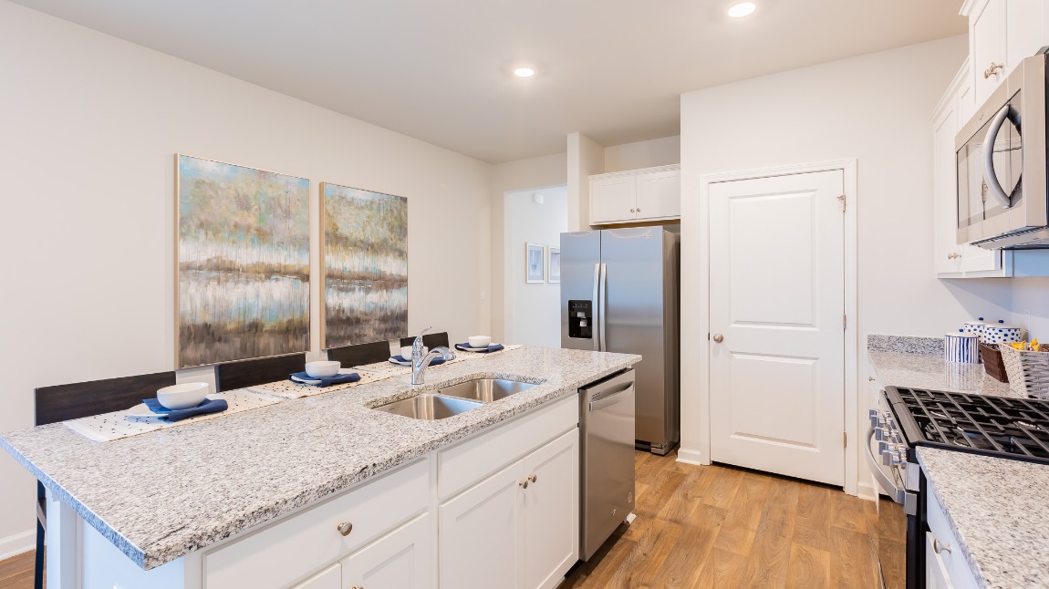 The foyer leads to the kitchen, dining room and living room.