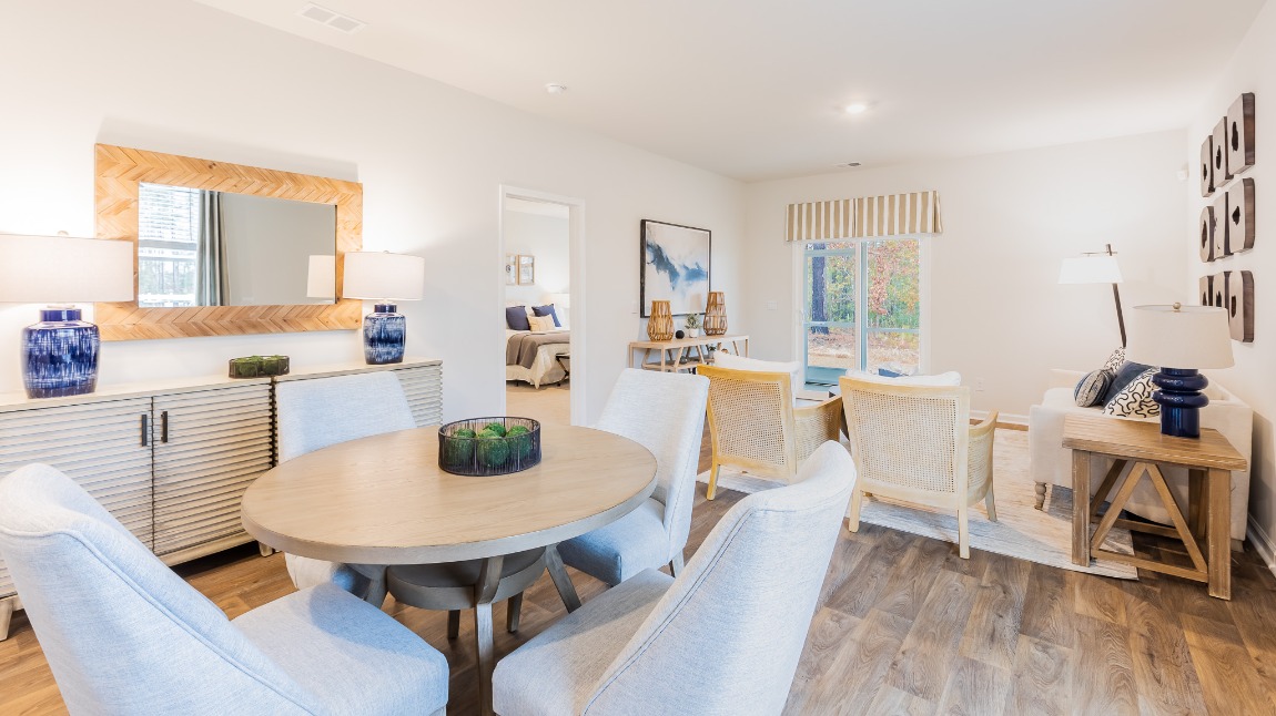 The open concept living areas with the primary bedroom located off of them.