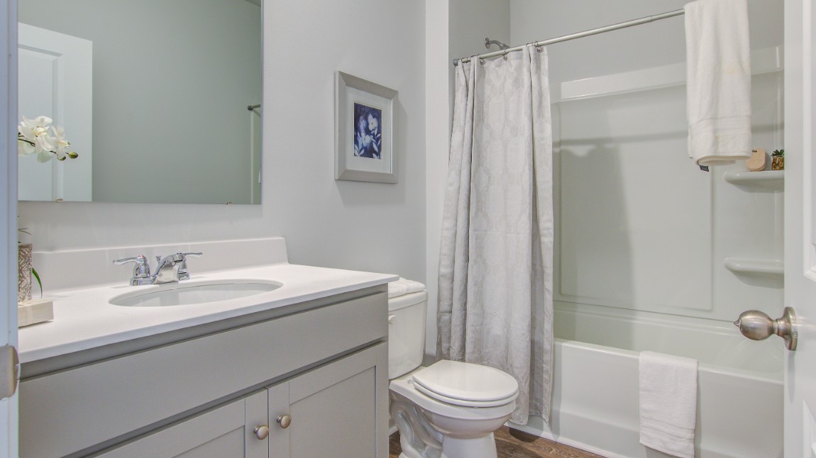 Bathroom 2 features a tub-shower combo.