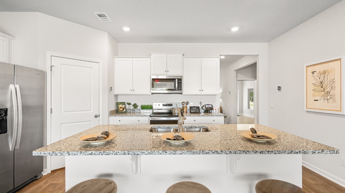 The kitchen island has room for barstools underneath for informal seating.