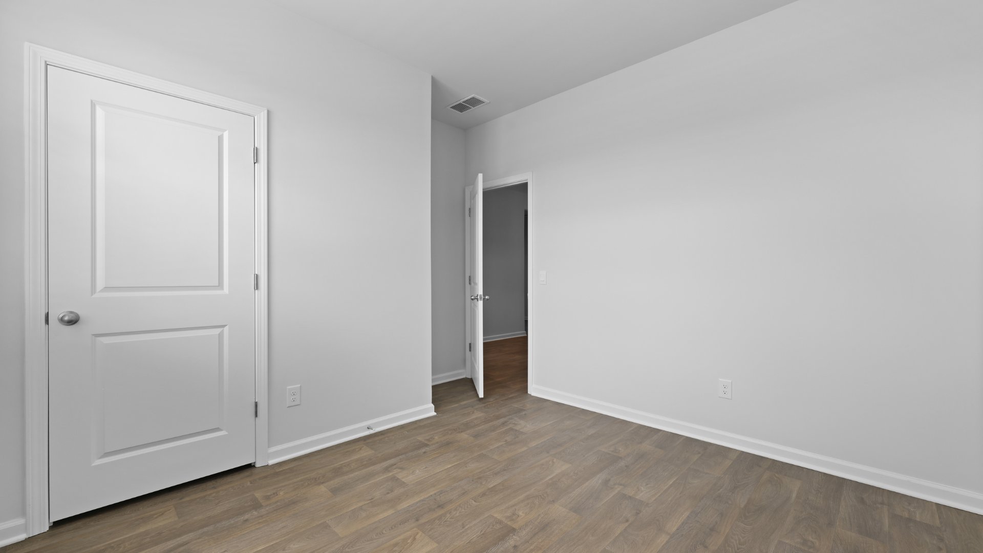 Spacious bedroom 2 in the Cali floorplan.