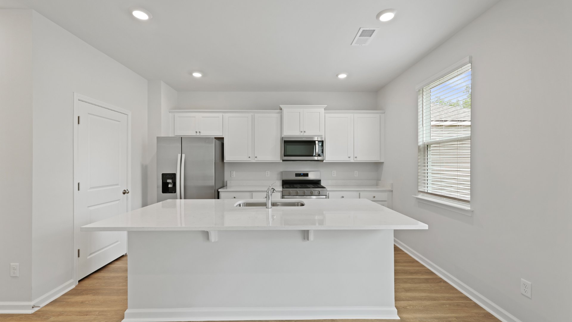 The kitchen island can fit barstools underneath it for extra seating.