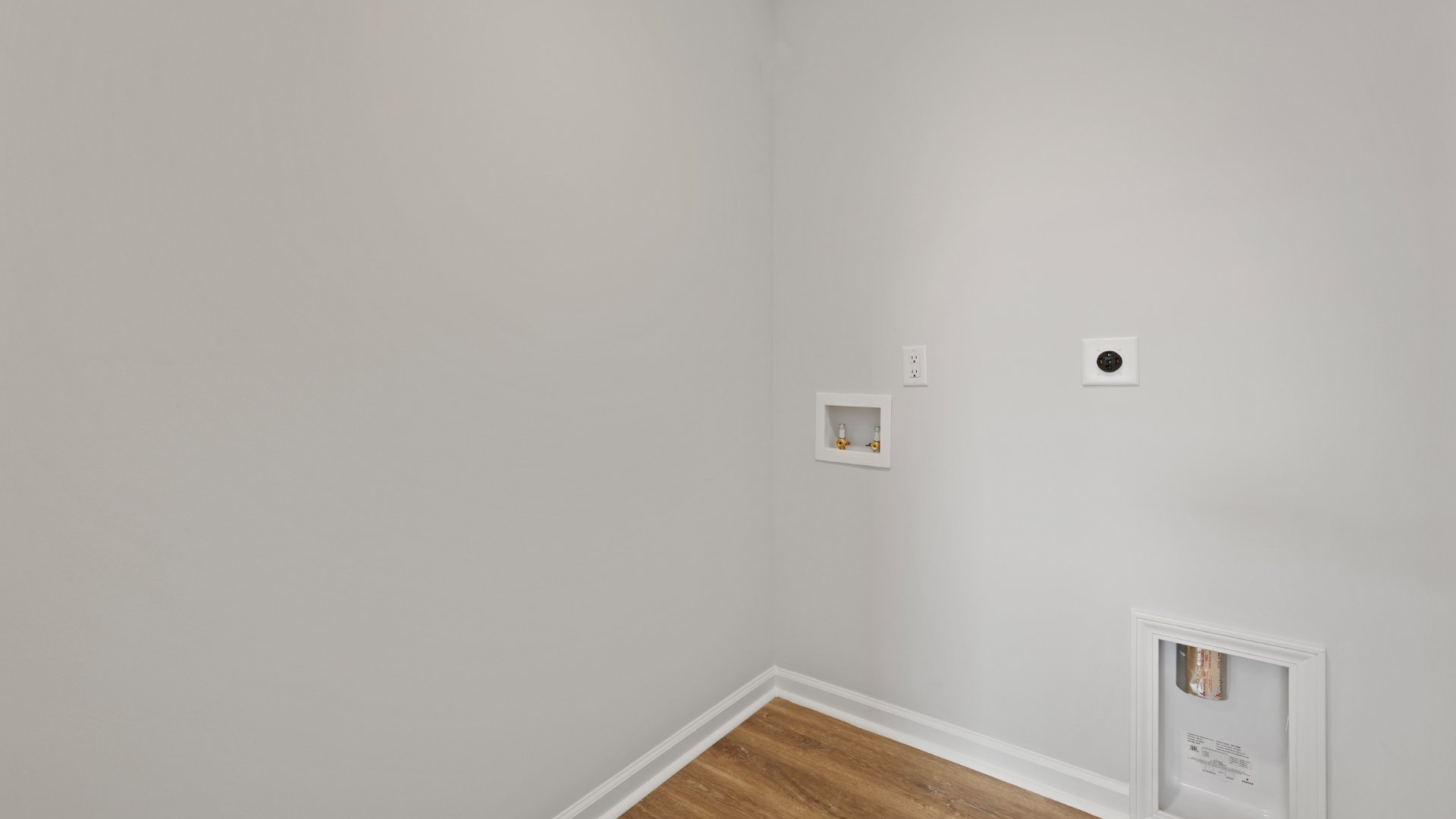 The laundry room is located upstairs.