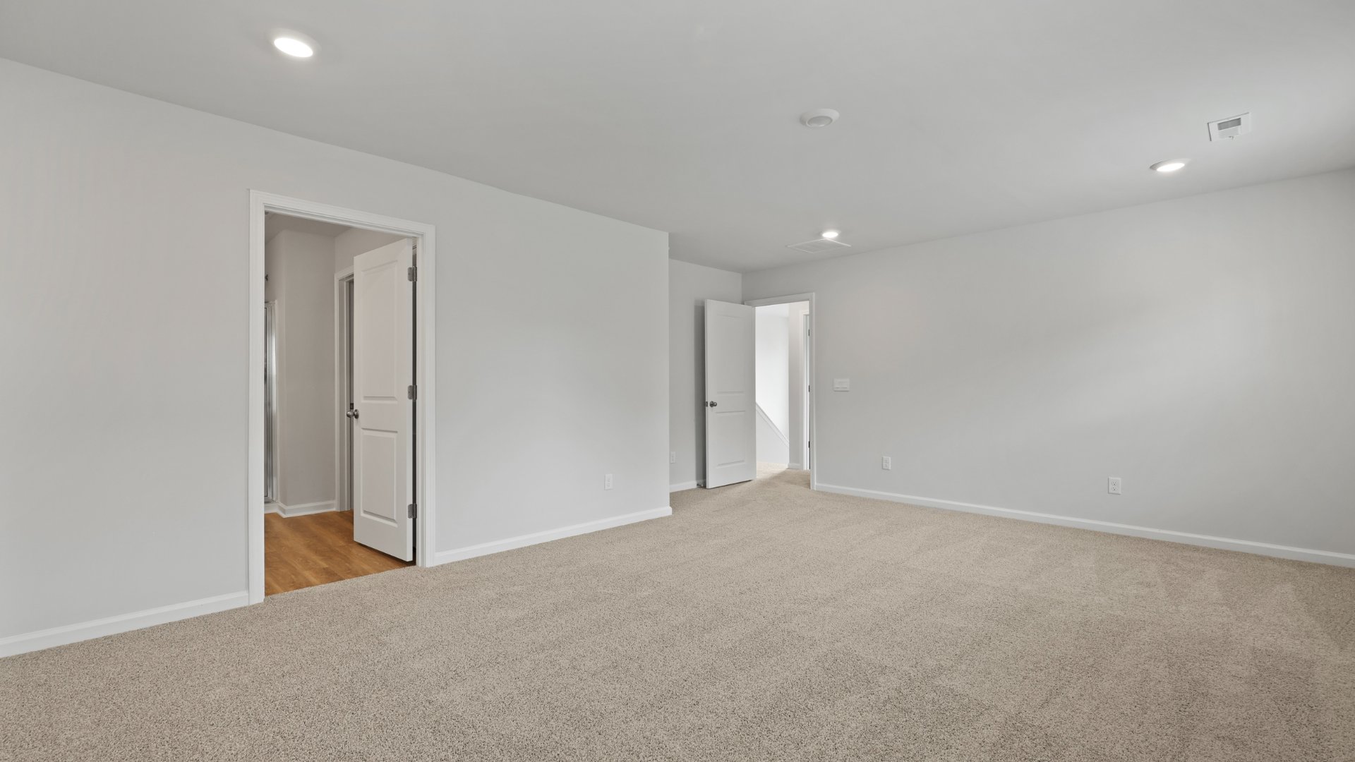 The primary bedroom is spacious and private.