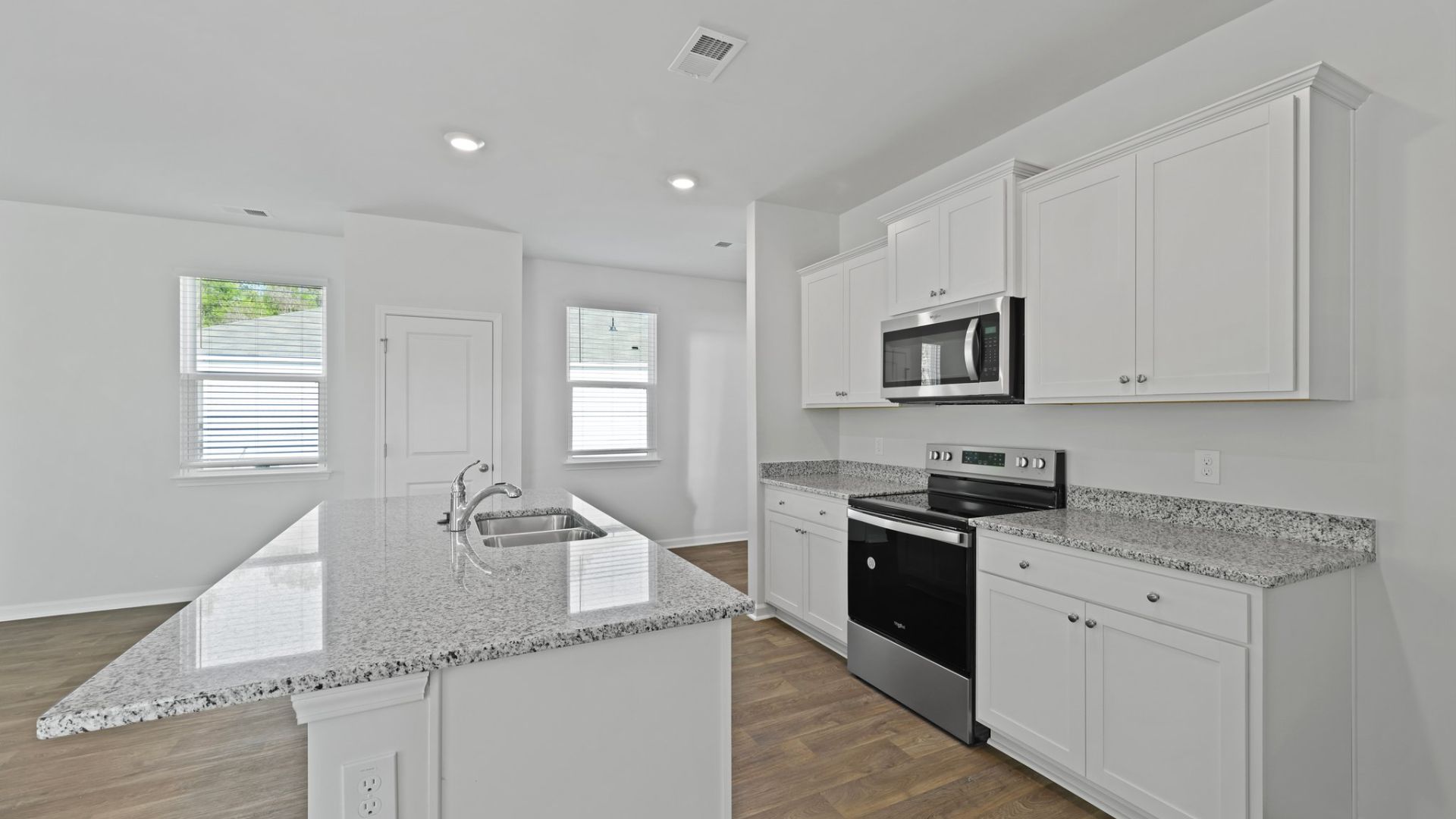 There is a granite kitchen island.