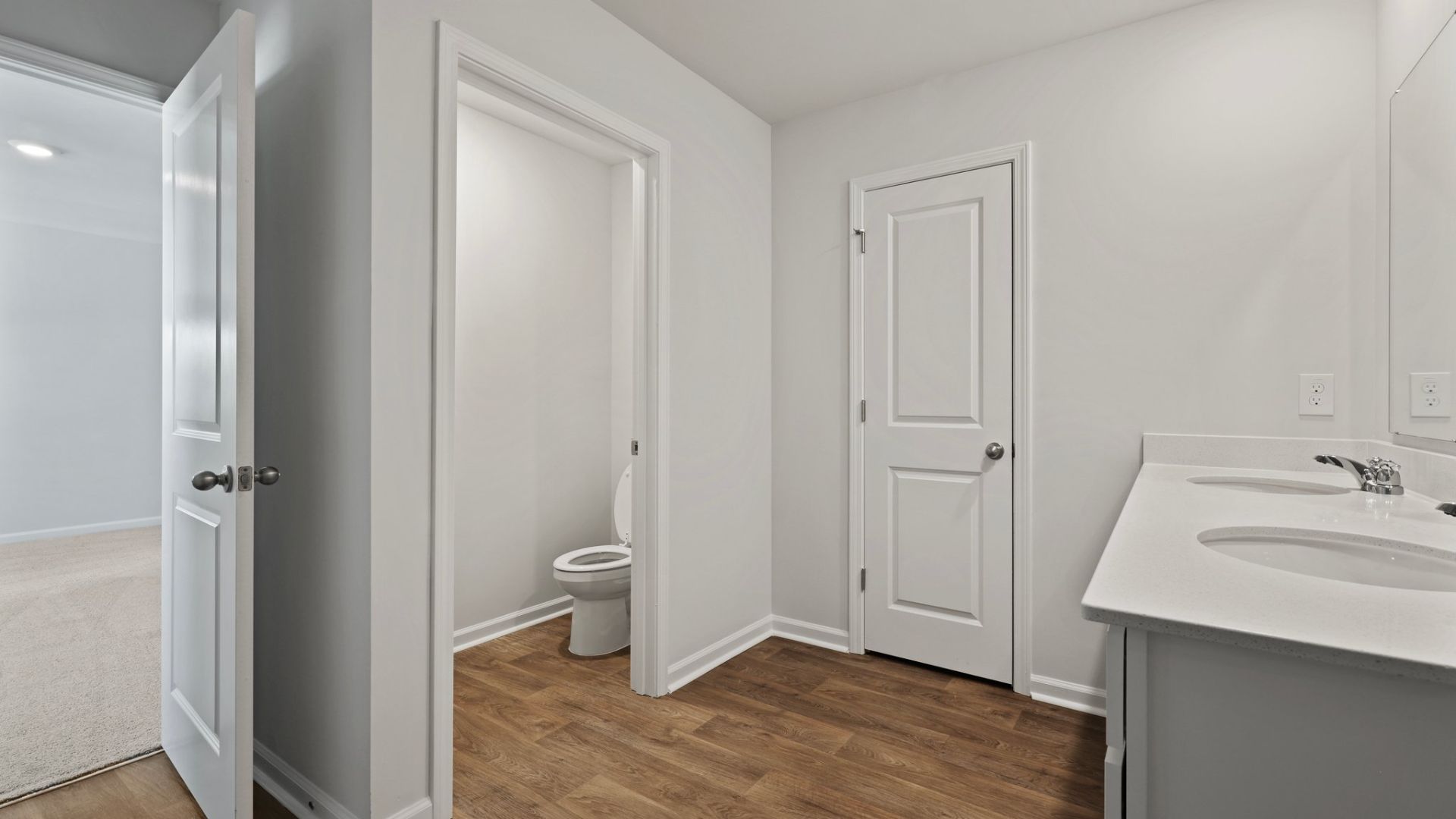 There is a room with to seperate the toilet from the main bathroom area.