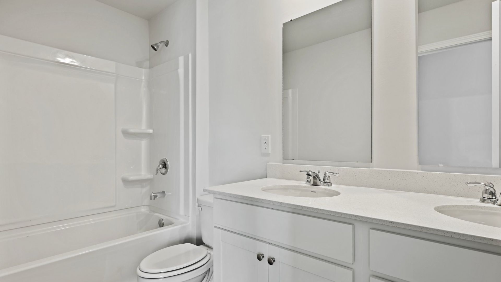 Bathroom 2 has two vanities and a tub-shower combo and is located upstairs.