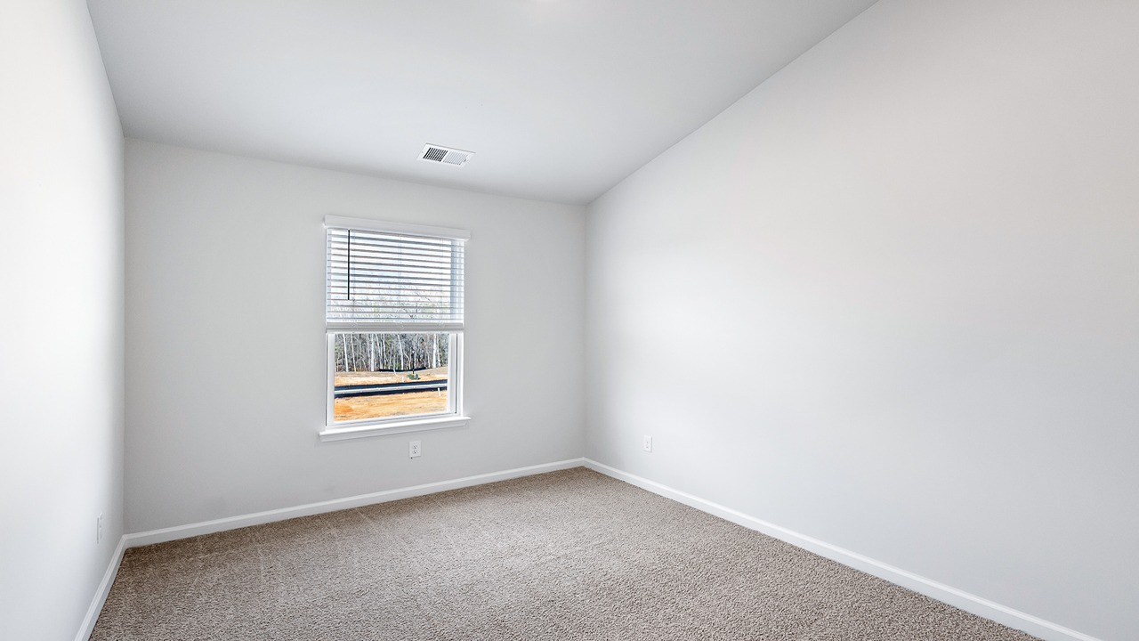 Second story guest room with vaulted ceilings