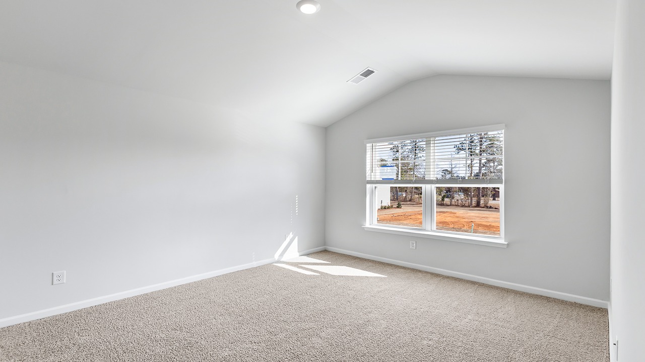 Master bedroom with vaulted ceilings