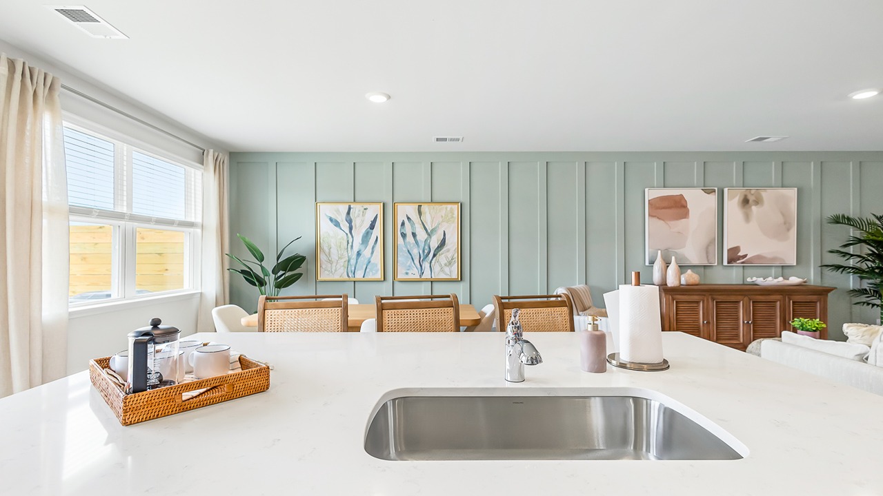 kitchen with white quartz counters and cabinets