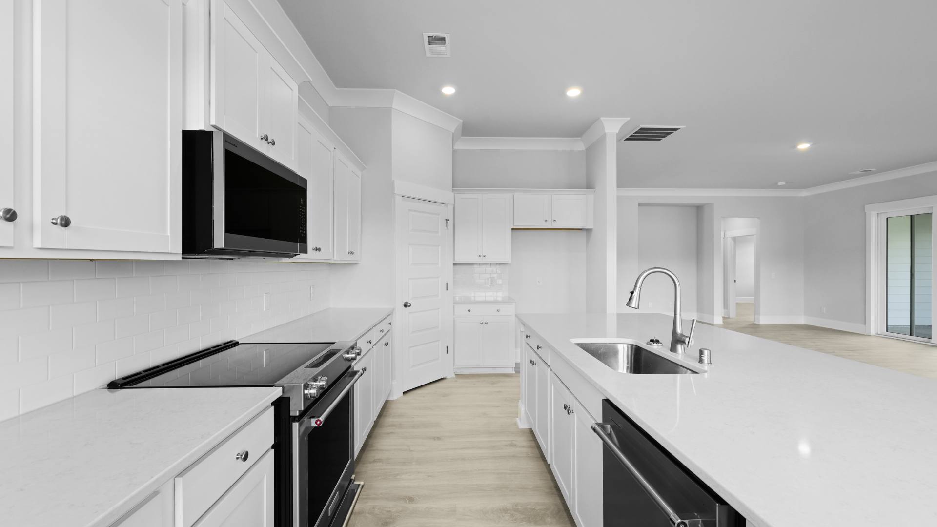 open concept kitchen white cabinets and counter tops