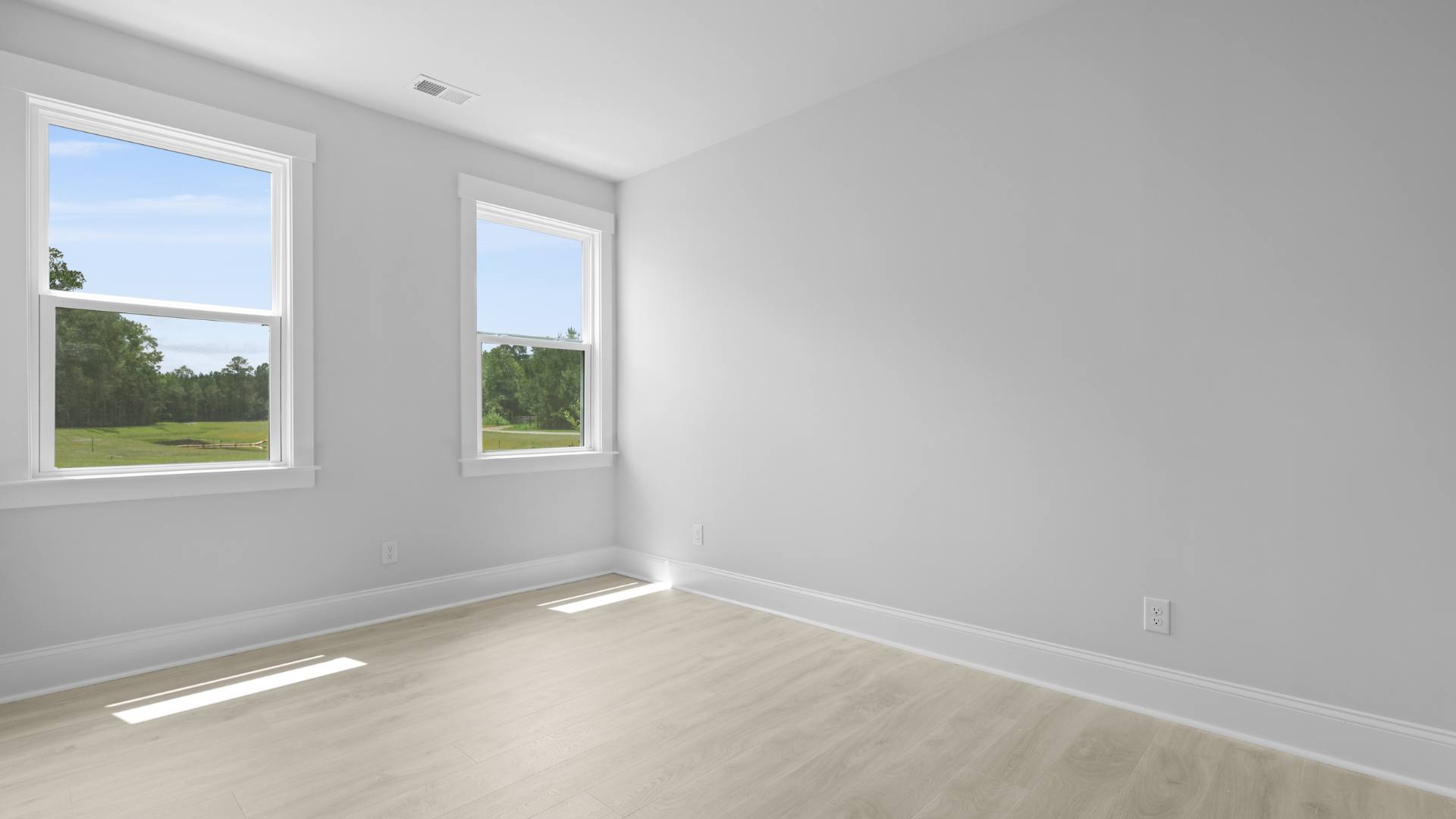 Spacious guest room with large windows