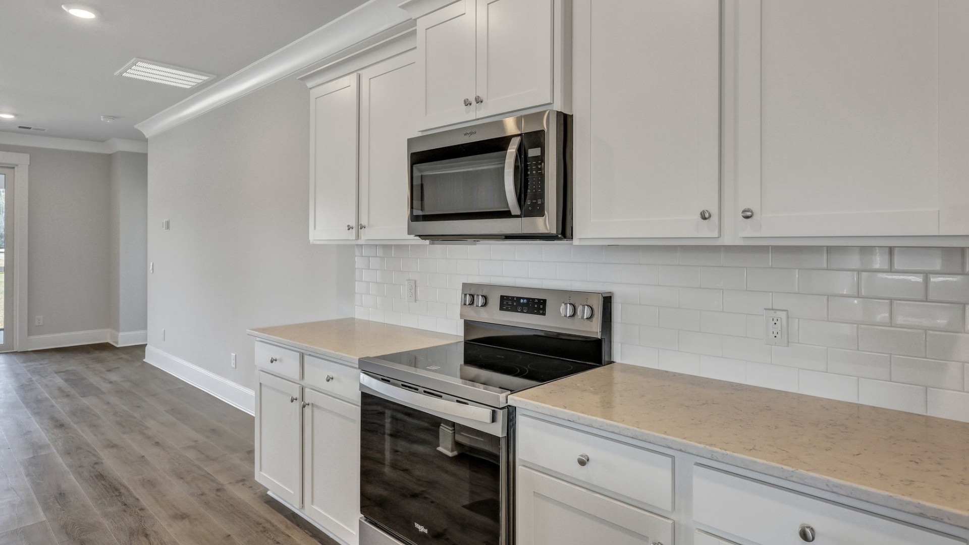 There are stainless steel appliances featured in this photo of the kitchen in the Trivecta floorplan.