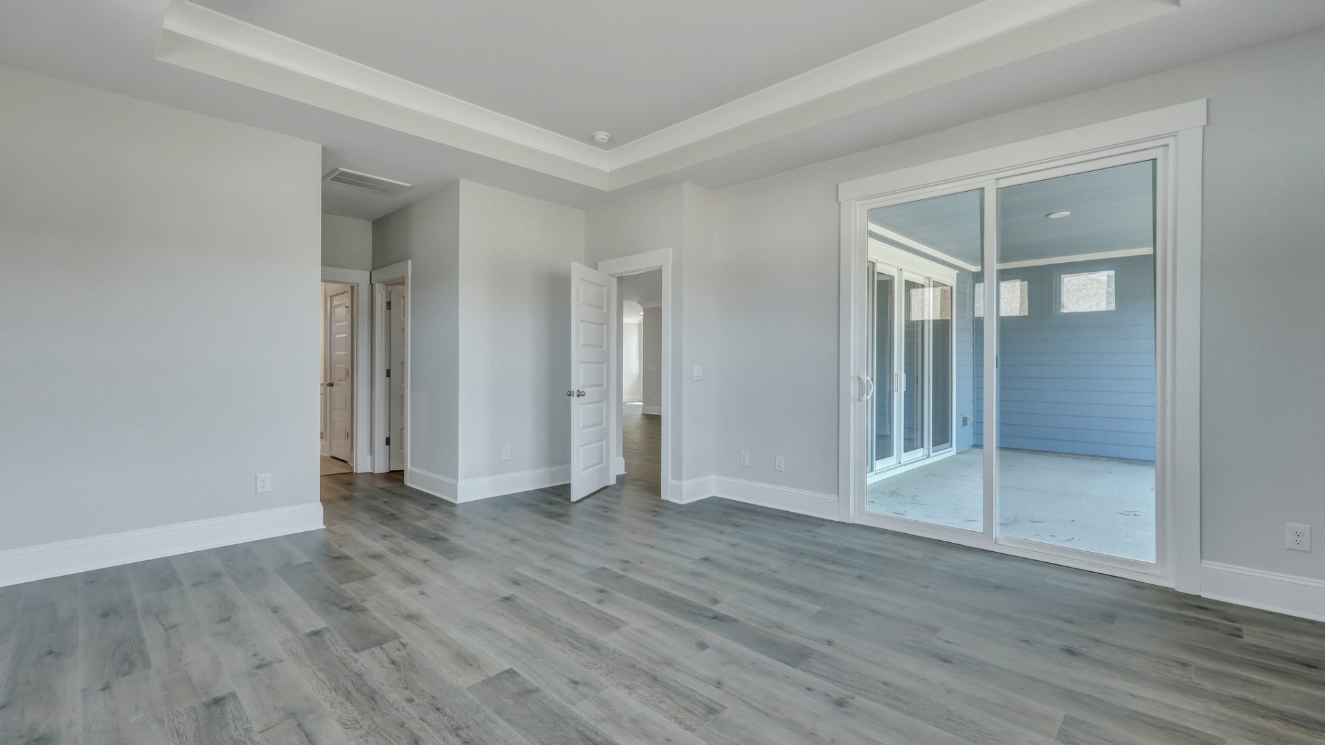 The primary bedroom has access to the patio from inside.
