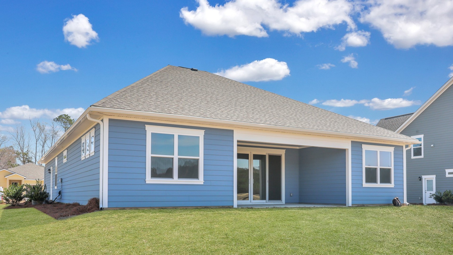 The covered patio on the rear of the Trivecta floorplan.