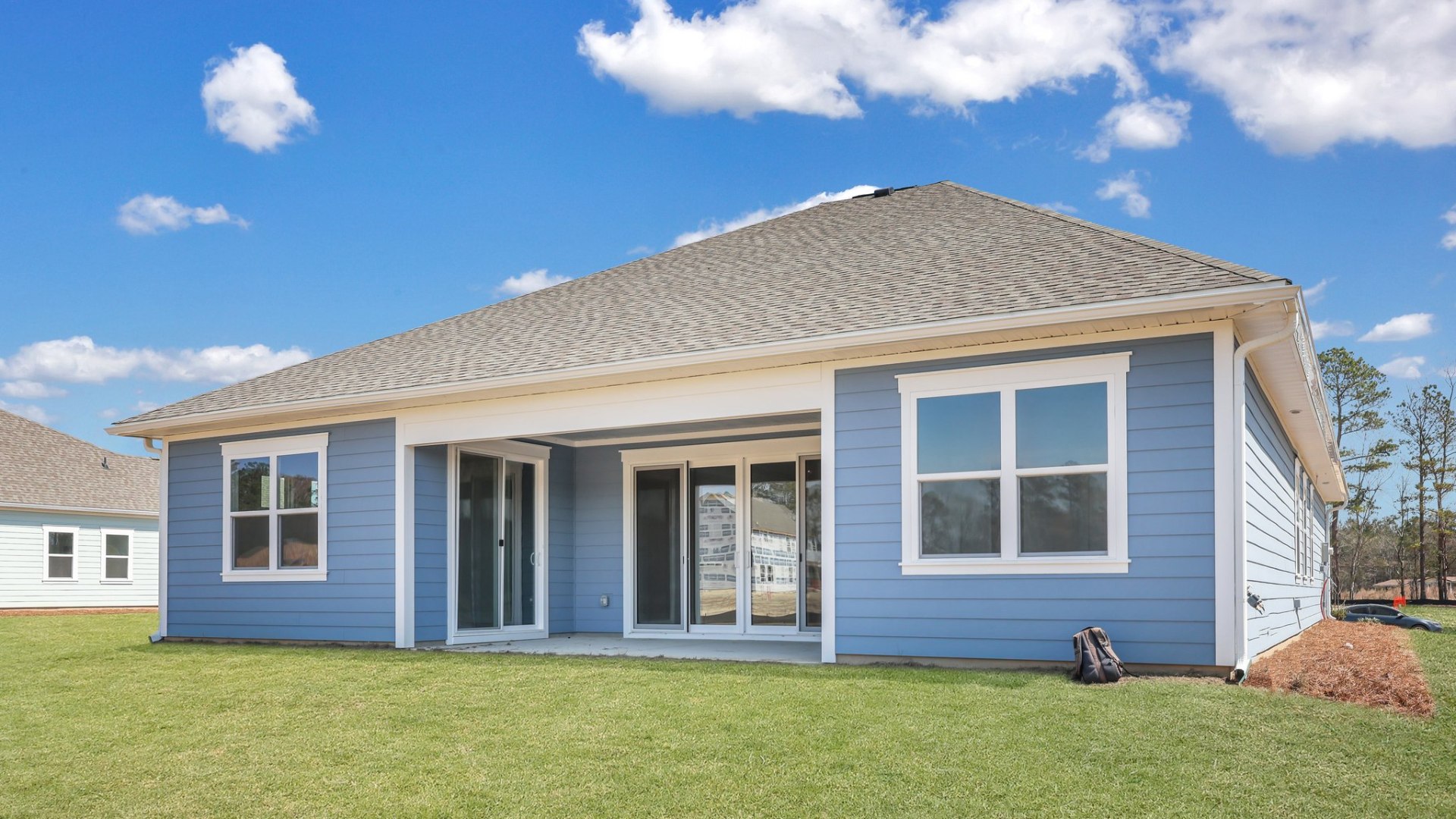 The covered patio on the Trivecta floorplan in Berkeley Bay located in Ridgeville, South Carolina.