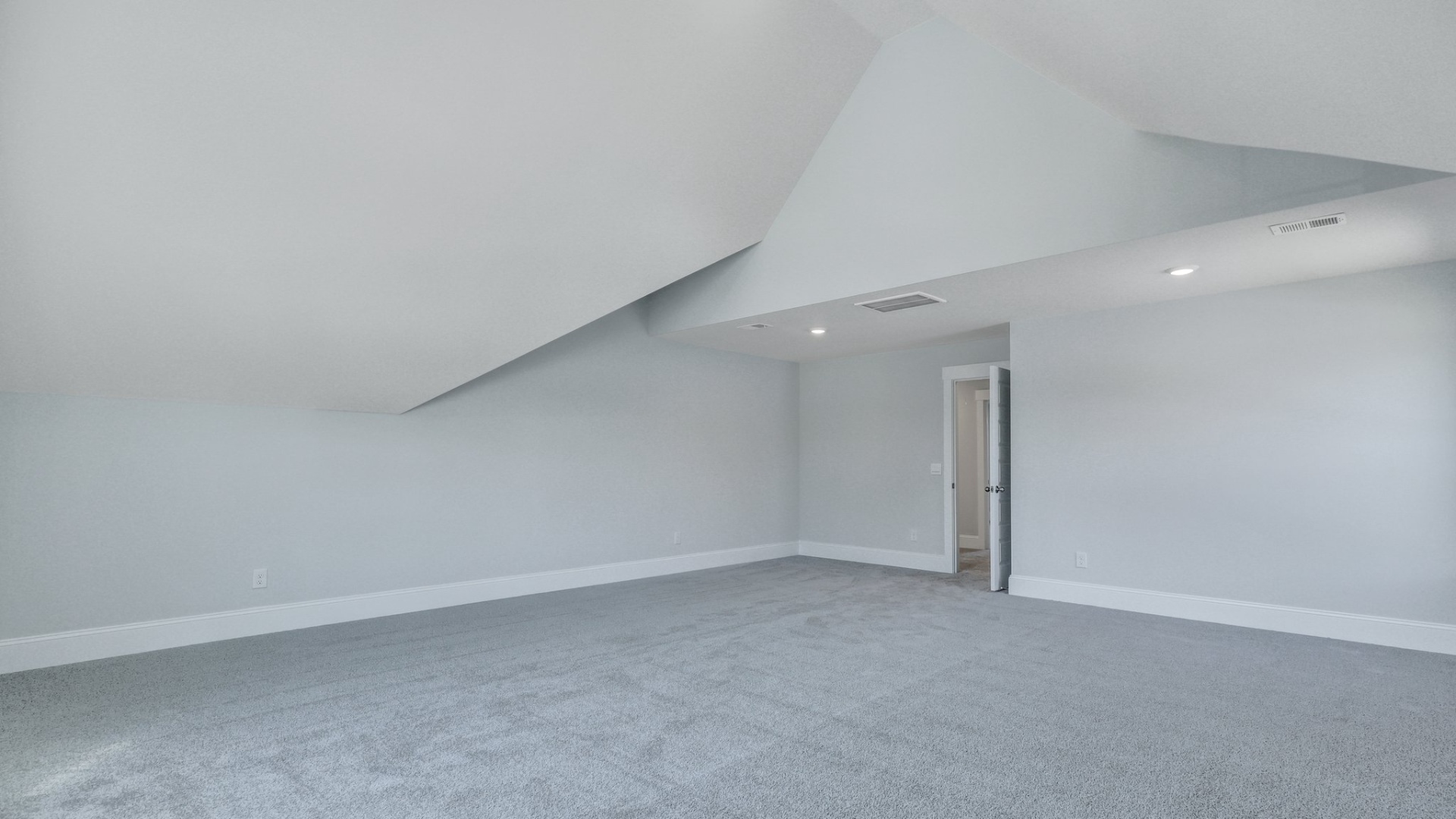 The spacious bonus room is carpeted and located upstairs.