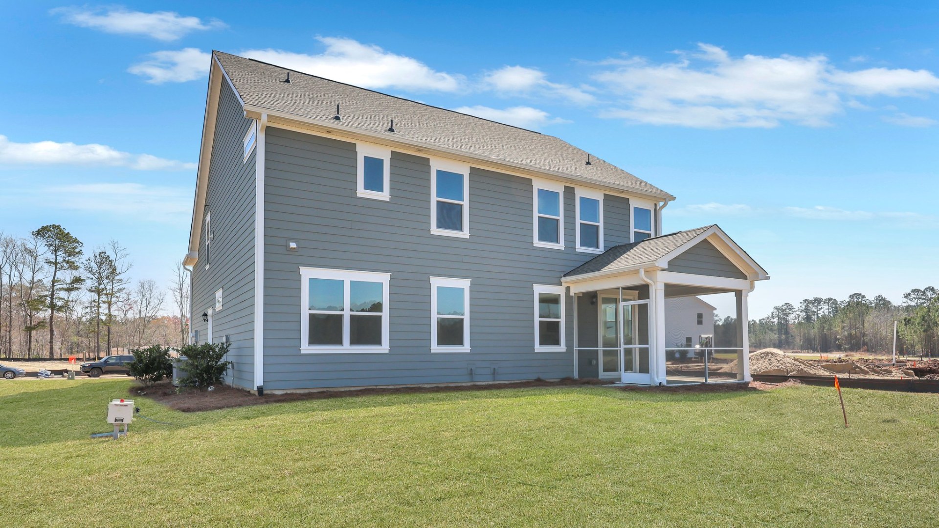 The rear exterior of the Forrester floorplan that showcases the patio and backyard.