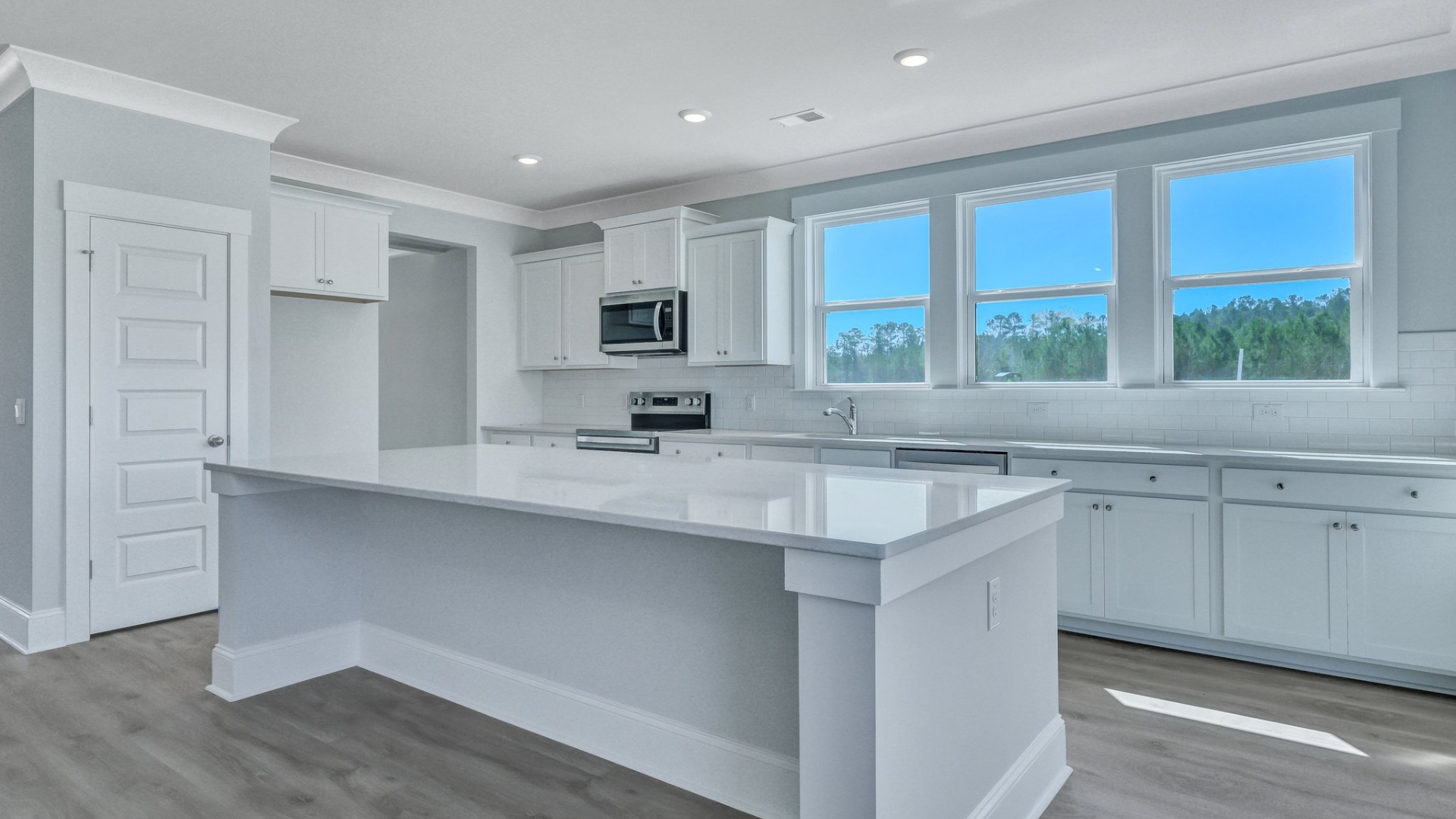Open concept kitchen with windows
