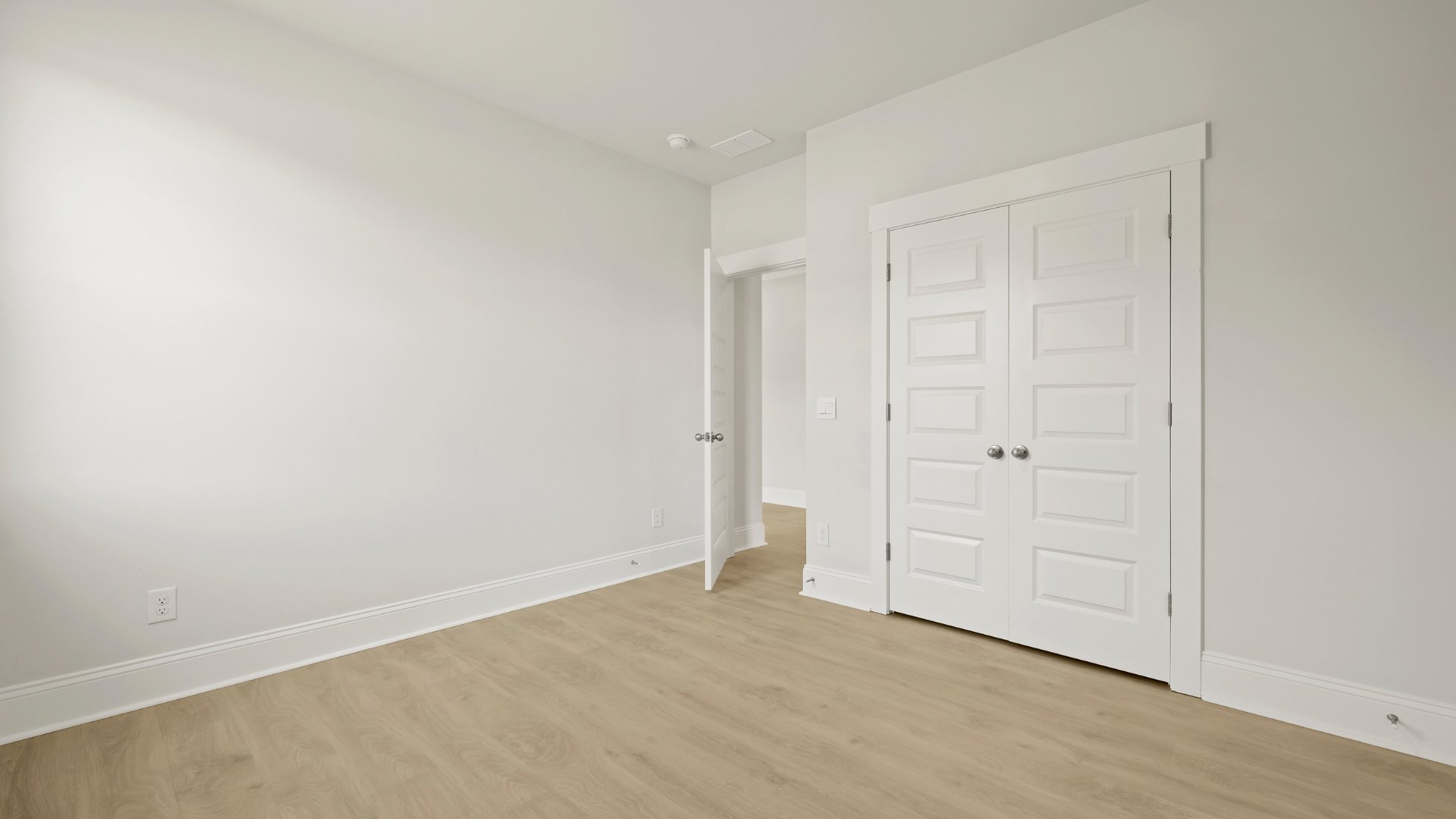 Bedroom 2 is spacious with a double door closet.