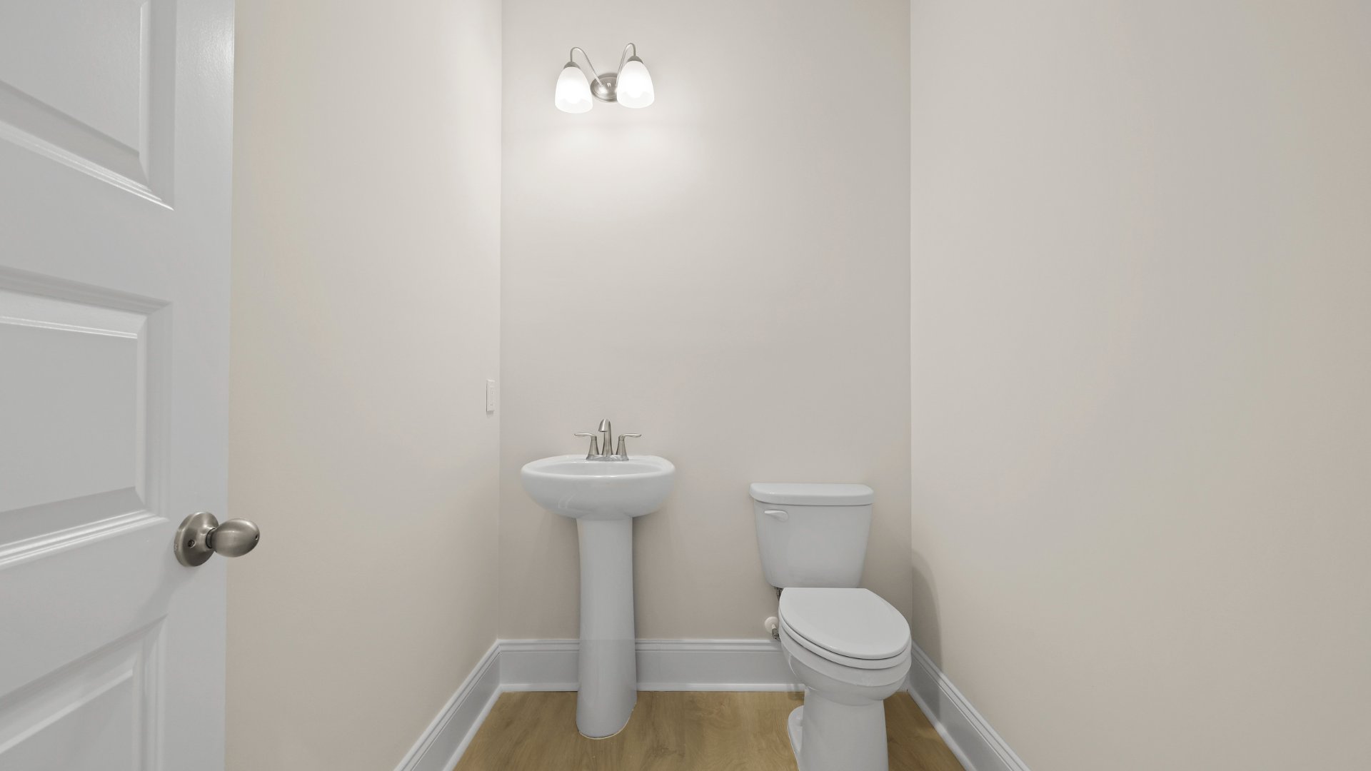 The powder room is located across from the living areas.