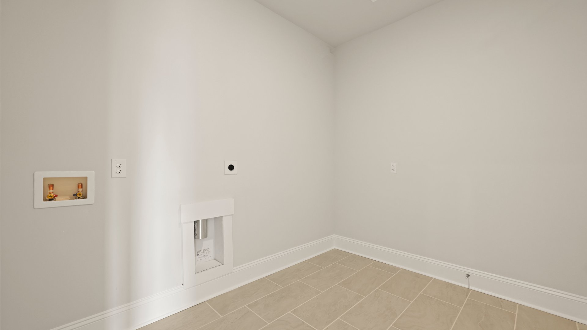 The laundry room is spacious and is located across from the Multi-gen suite.