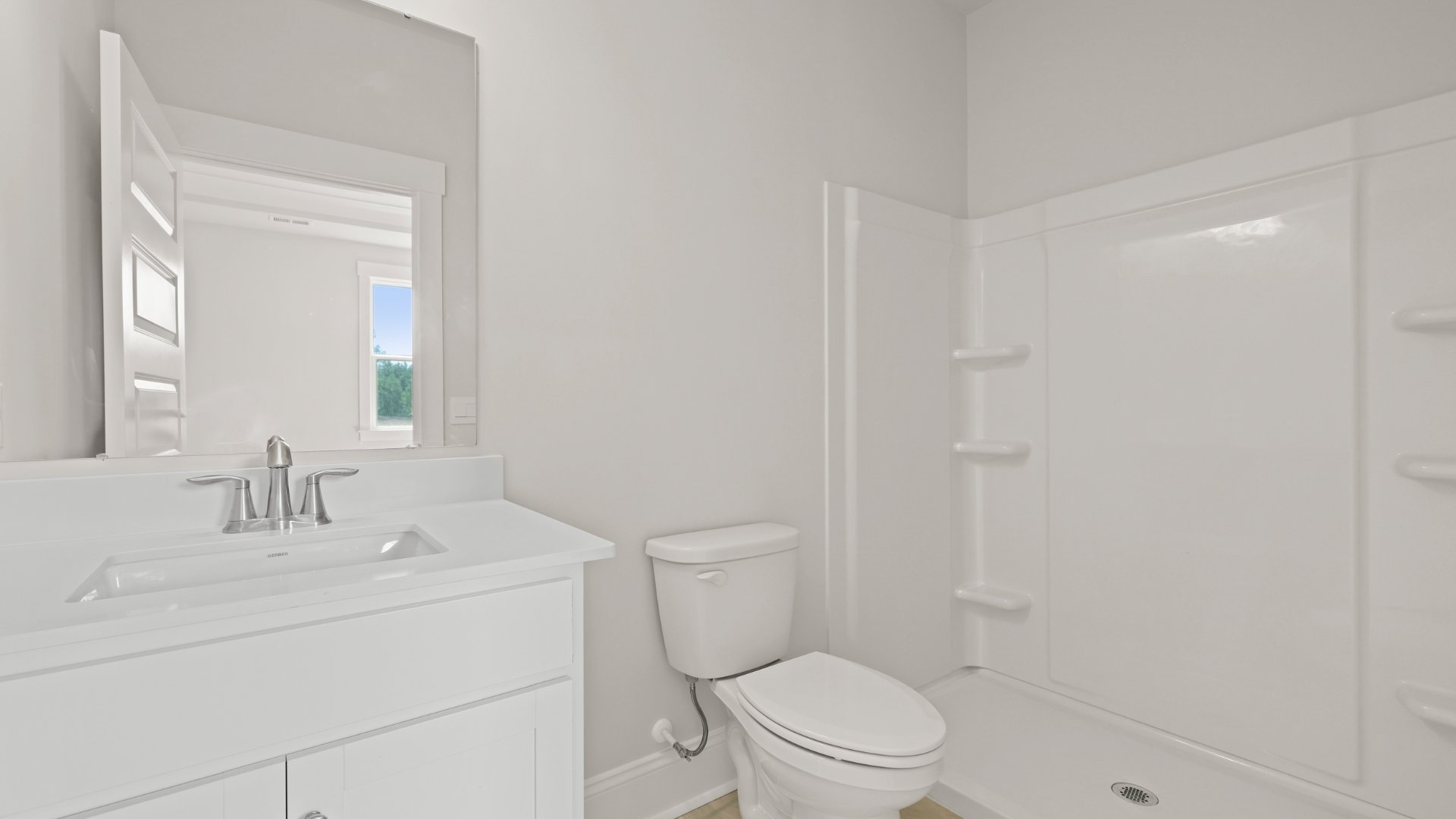 The bathroom in the multi-gen suite has quartz countertops and a stand-up walk-in shower.