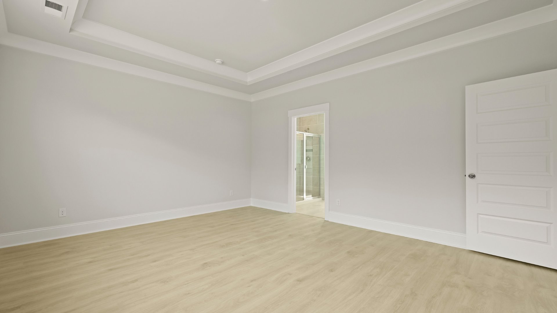 The primary bathroom is located within the primary bedroom.