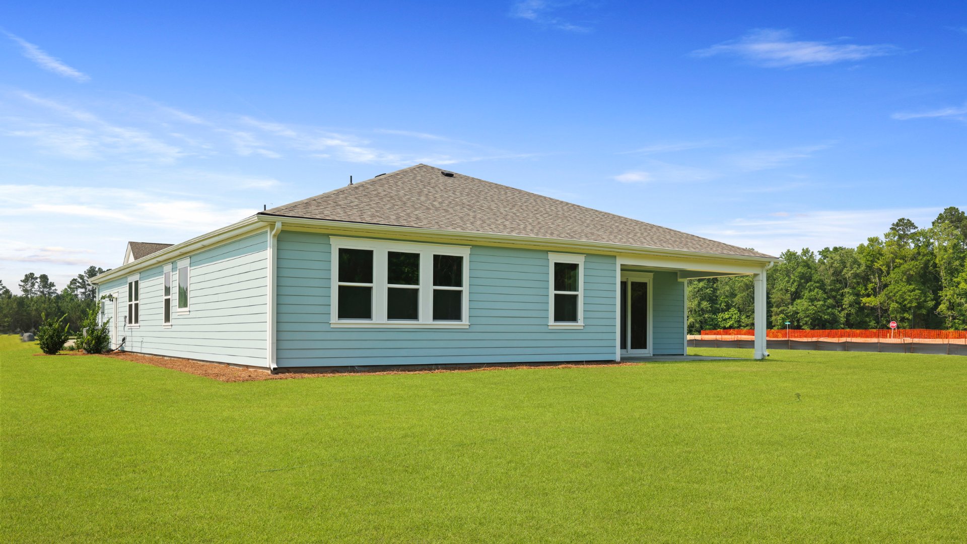 The rear exterior of the Camden floorplan located in Berkeley Bay, in Ridgeville, South Carolina.