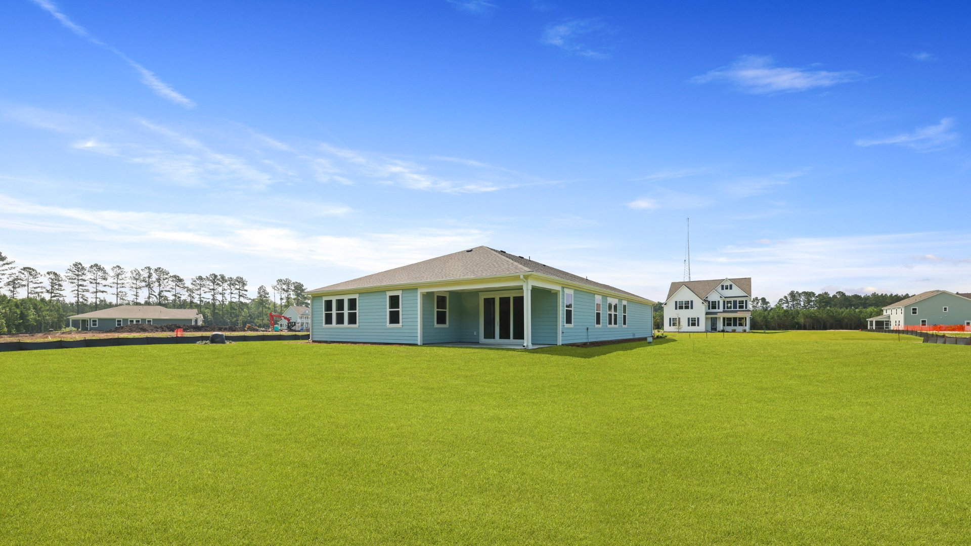 The rear exterior features the back covered patio and the backyard of the Camden floorplans.