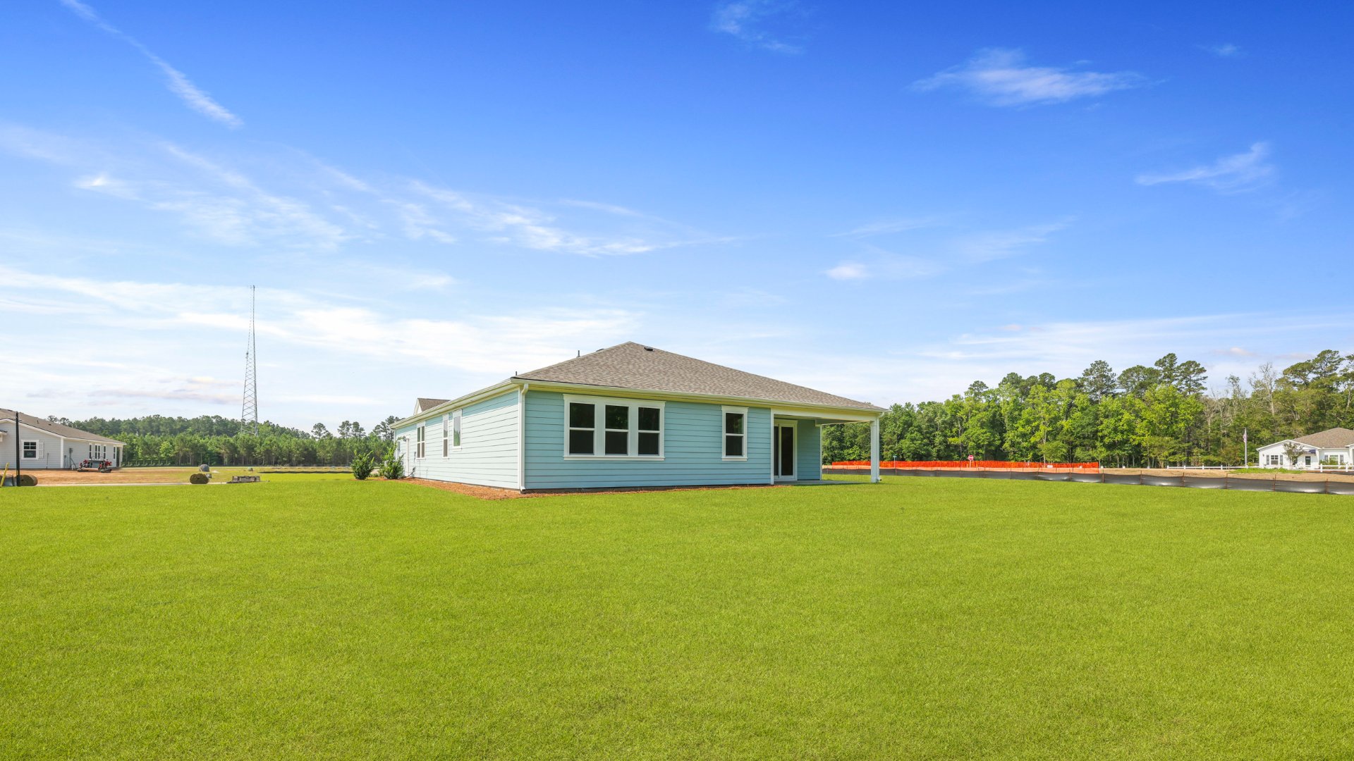 The rear exterior of the Camden floorplan located in Berkeley Bay, in Ridgeville, South Carolina.